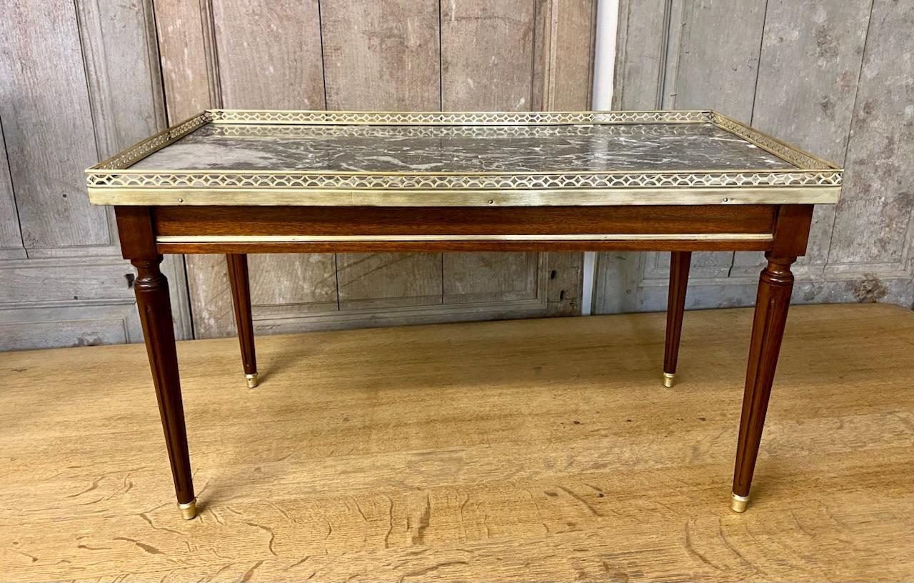 A superb French Louis XVI Coffee Table, having a drawer to one end and of excellent quality as can be seen by the dovetails. The marble top is perfect and has a delightful pieced gallery around and brass capped feet. We have totally re finished this