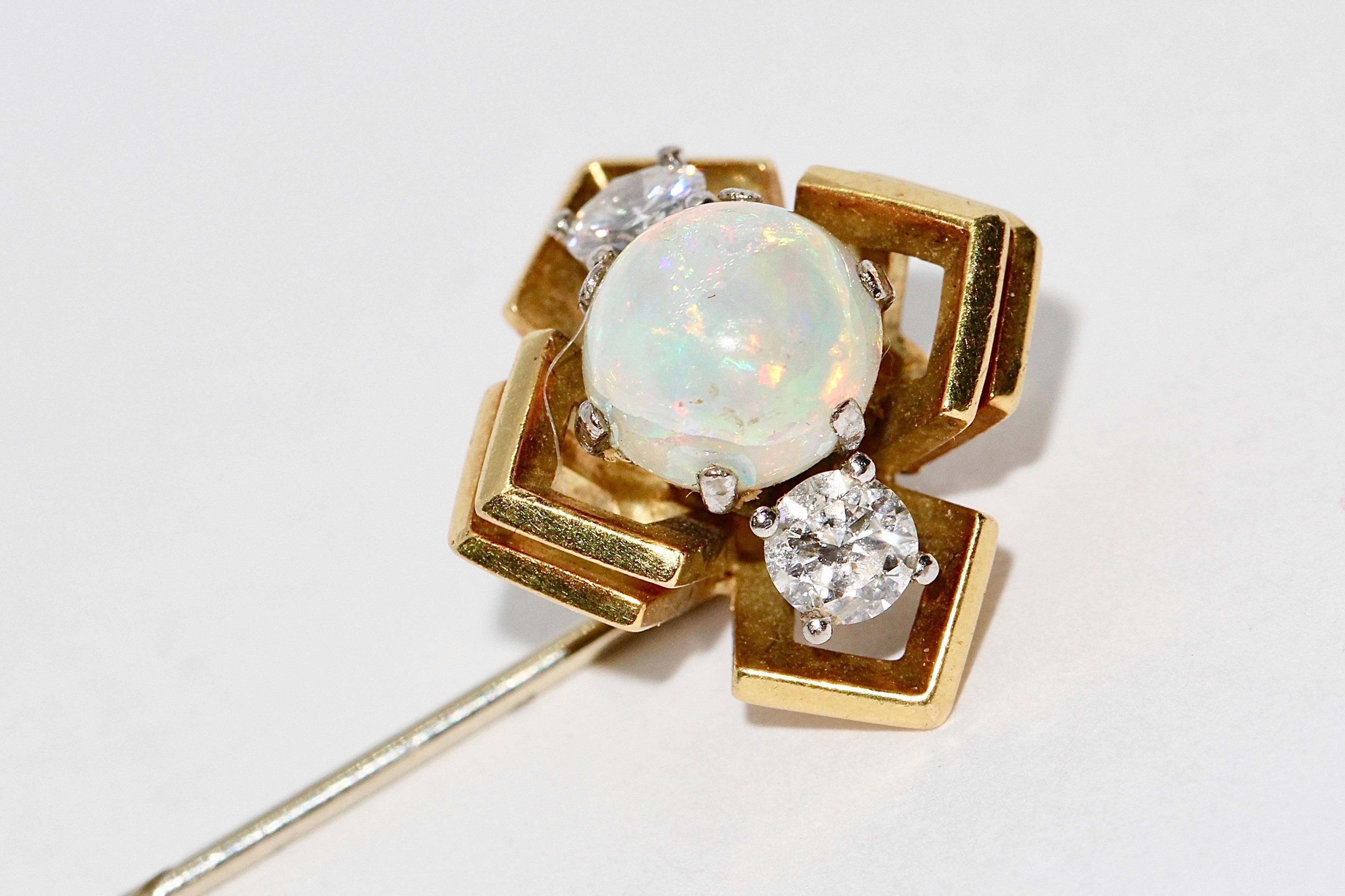 Pretty Gold Pin with Opal and two Diamond Solitaires.

Diamonds each about 0.16 carat, very good quality!