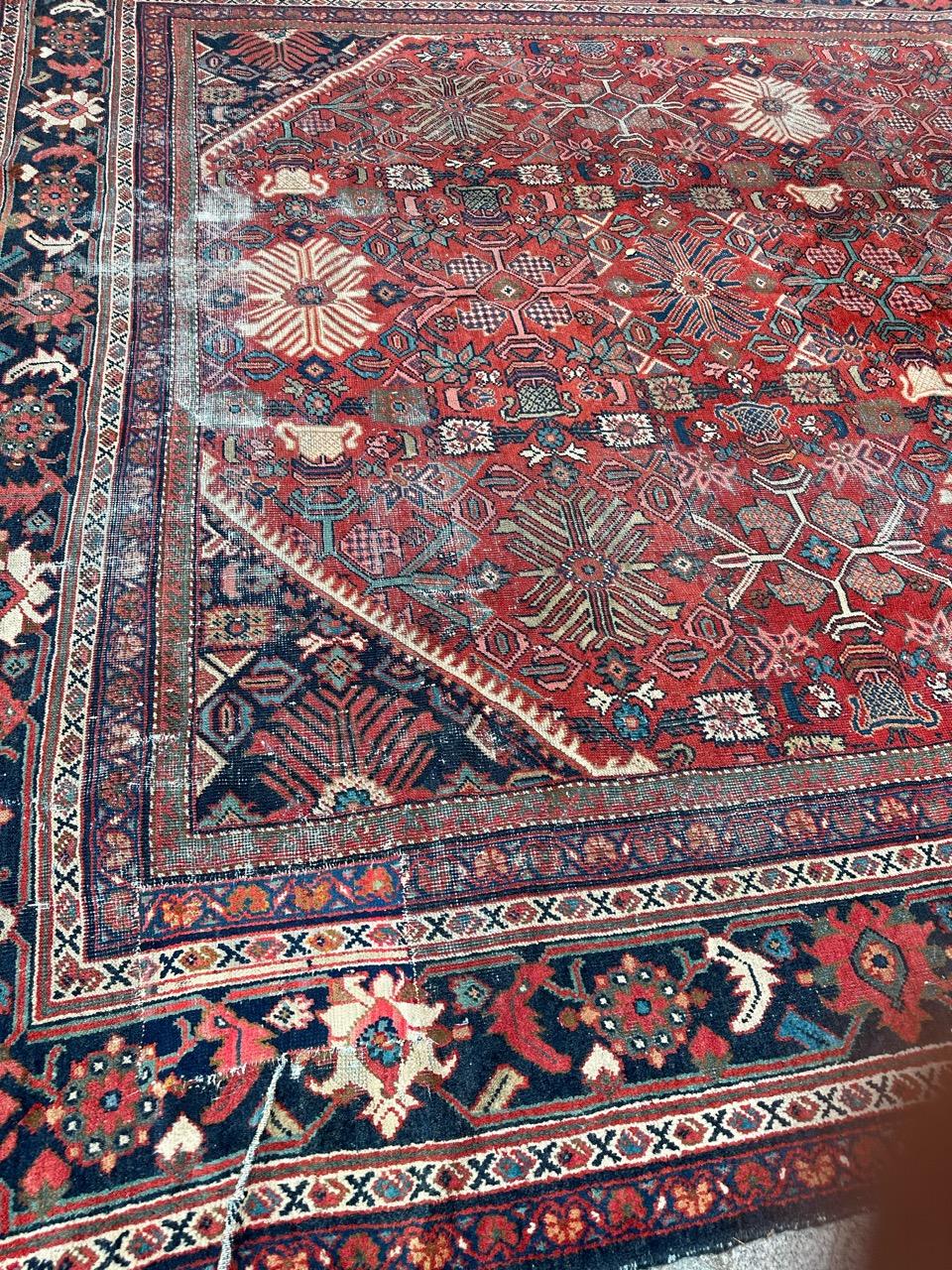 Presenting a remarkable late 19th-century mahal rug, adorned with exquisite decorative designs and captivating natural colors. This stunning piece, entirely hand-knotted with wool velvet on a cotton foundation, carries with it the rich history of