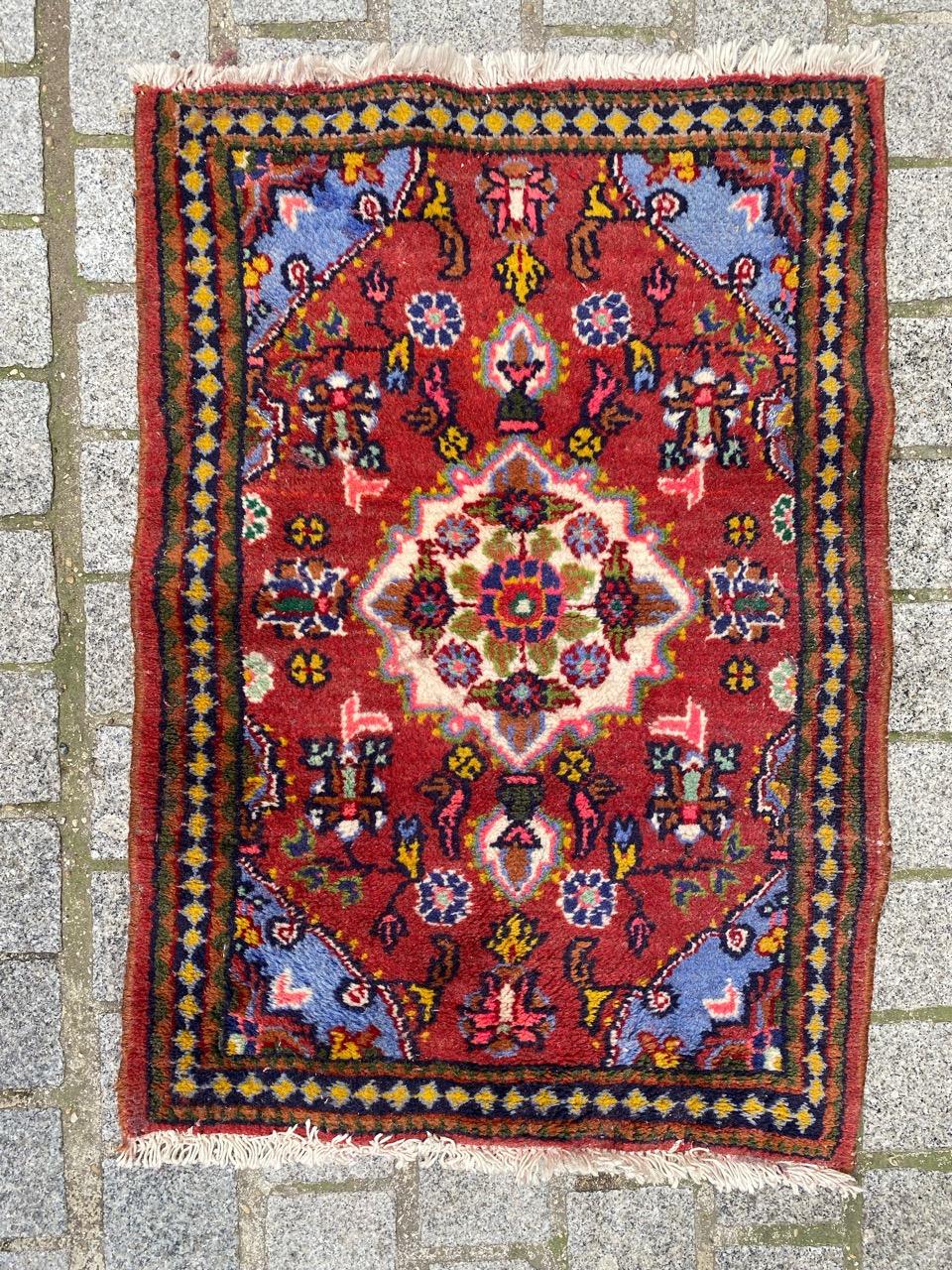 Beautiful little mid century Hamadan rug with beautiful geometrical design with nice colors in a red field with light blue, yellow and pink on design. Entirely hand knotted with wool velvet on cotton foundation 

