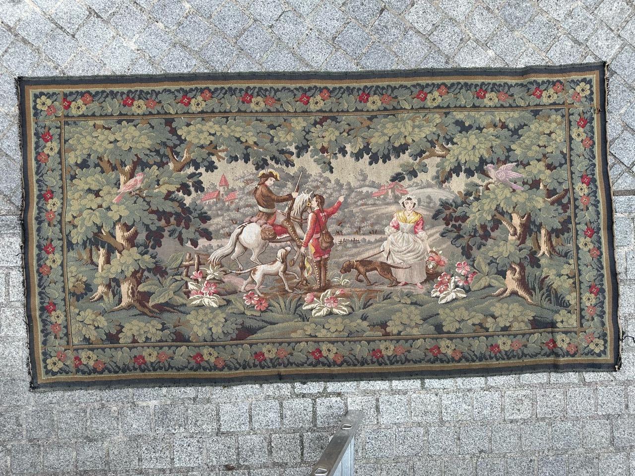 Stunning midcentury French tapestry, featuring a design inspired by the medieval tapestry from museum, « La Filandiere » . Called « return from hunting ». This woolen tapestry beautifully portrays a hunting end scene with vibrant colors,