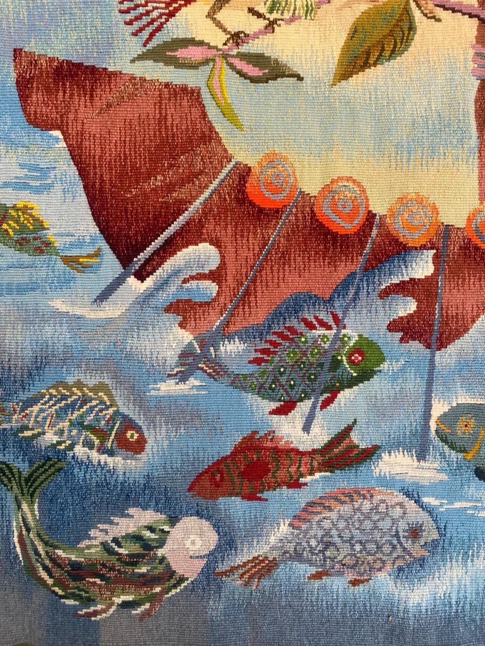 Very pretty mid century french Aubusson tapestry with beautiful design of the boat with birds and fish at the sea. ( with monogram on the Bottom, With beautiful colors, entirely hand woven at « ateliers du chat » manufacturing at Aubusson, with wool