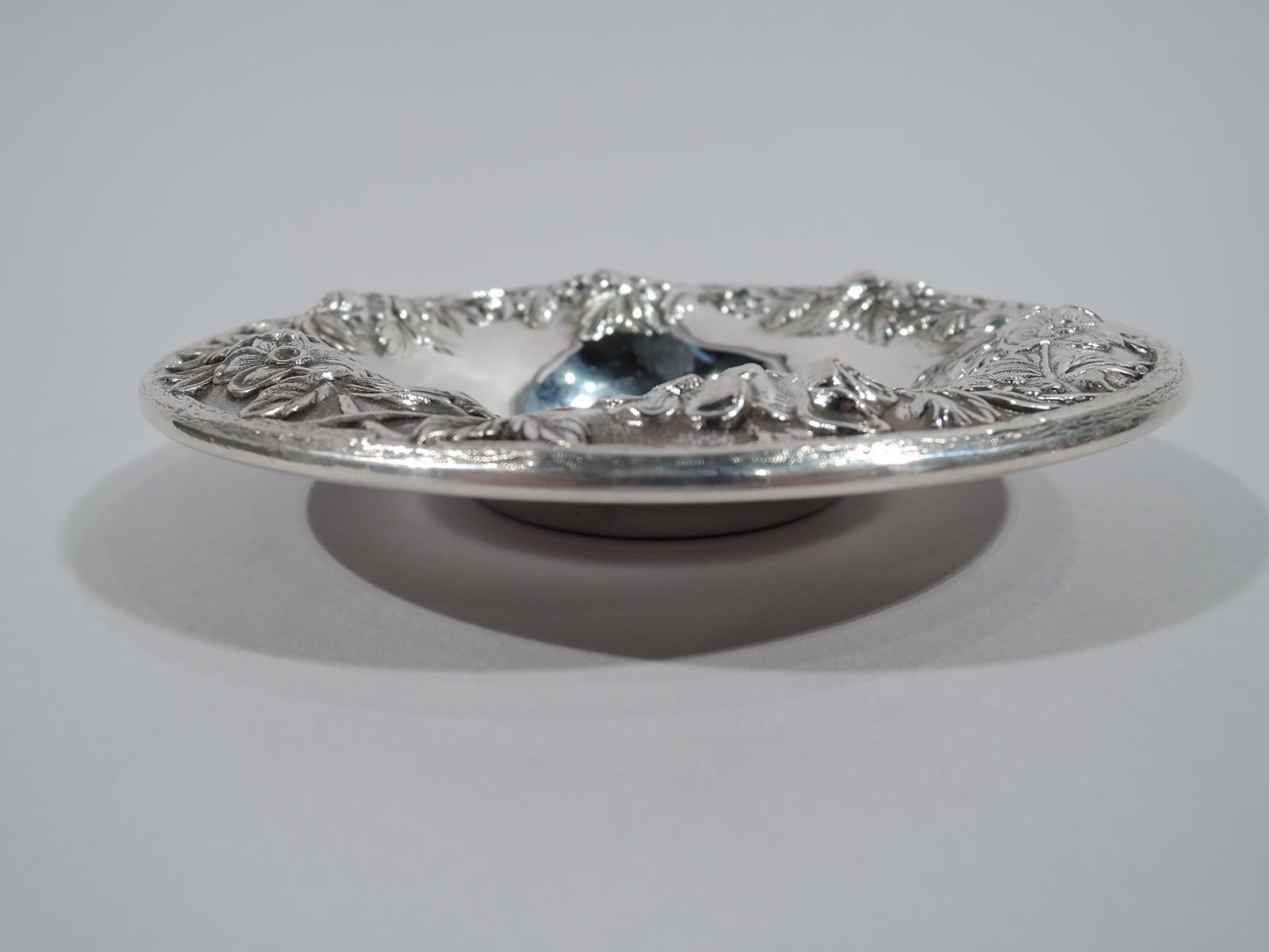Pretty old-fashioned sterling silver bowl. Made by S. Kirk & Son in Baltimore. Plain deep well and wide mouth with repousse floral border and twig rim. Very sweet. Fully marked including maker’s stamp (1932-61) and no. 13F. Weight: 4 troy ounces.