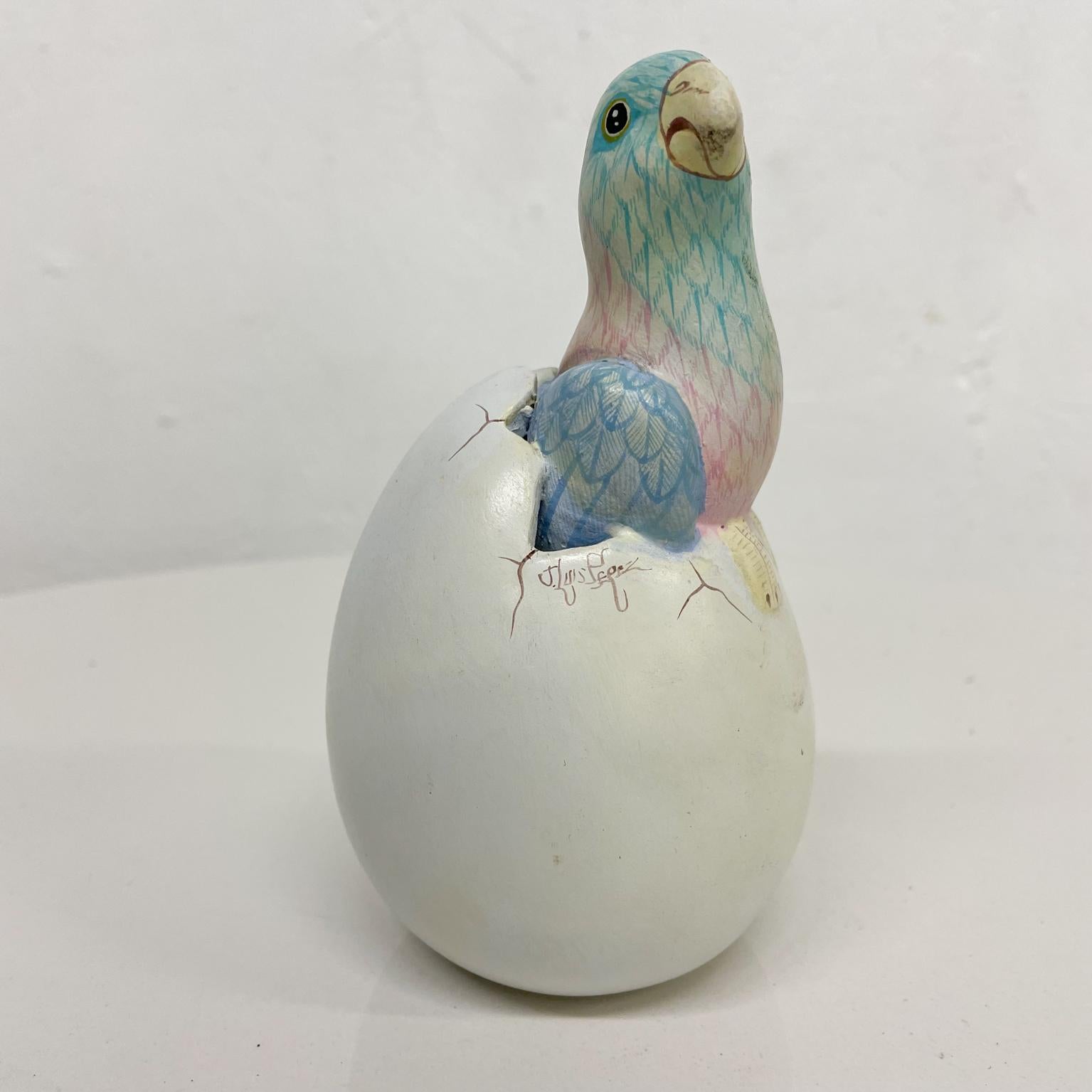 Bird
Pretty Parrot Egg Hatching Ceramic Art Pottery Mexico Style of Sergio Bustamante 1980s
Ceramic Folk Art sculpture from Mexico
In the style of Sergio Bustamante signed J Luis Perez
5.63 tall x 3.25 diameter
Preowned vintage unrestored
