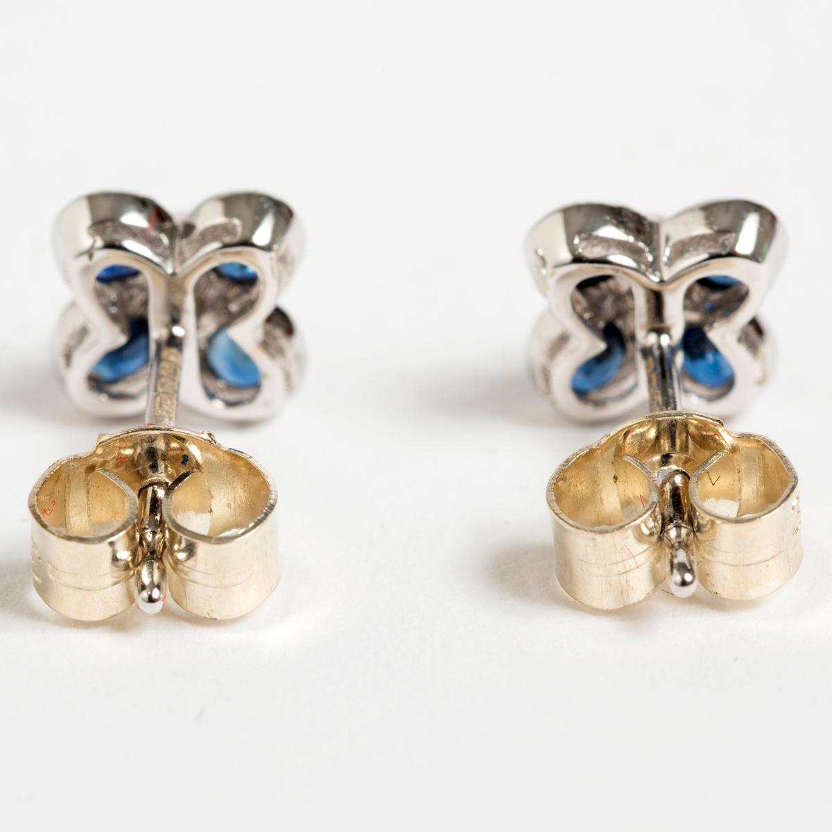 Round Cut Pretty Petal Shaped Diamond & Sapphire Stud Earrings, .06 carat. For Sale