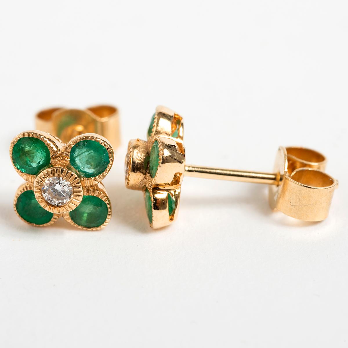 A unique piece within our carefully curated Vintage & Prestige fine jewellery collection, we are delighted to present the following: These pretty petal shaped emerald and diamond earrings are .06 carat, measuring 5mm x 5mm.