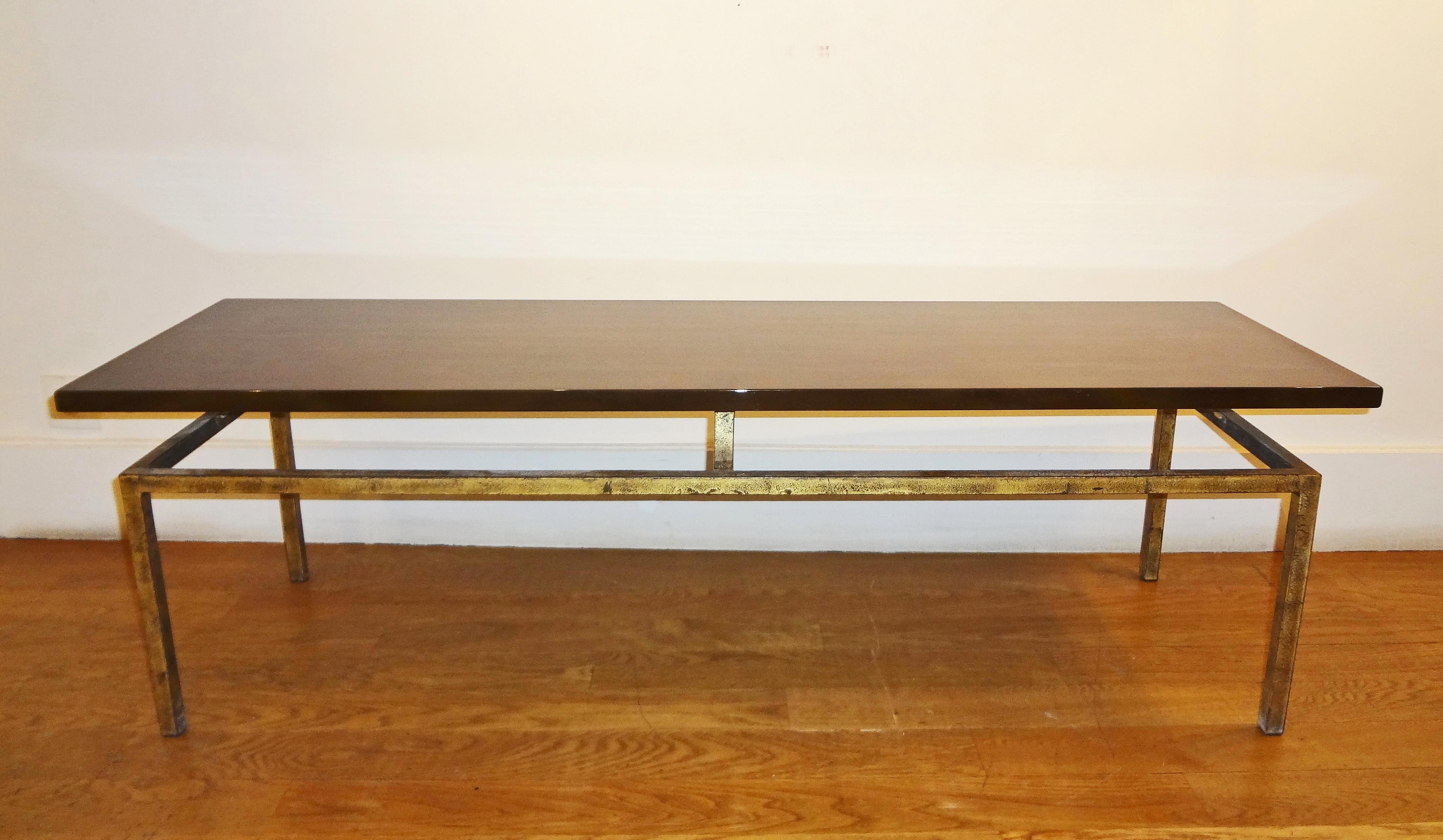 Roger Thibier, 1970s.
Pretty rectangular coffee table, 1960s.
Cloudy brown lacquered top, on a gilt patinated iron base.
     