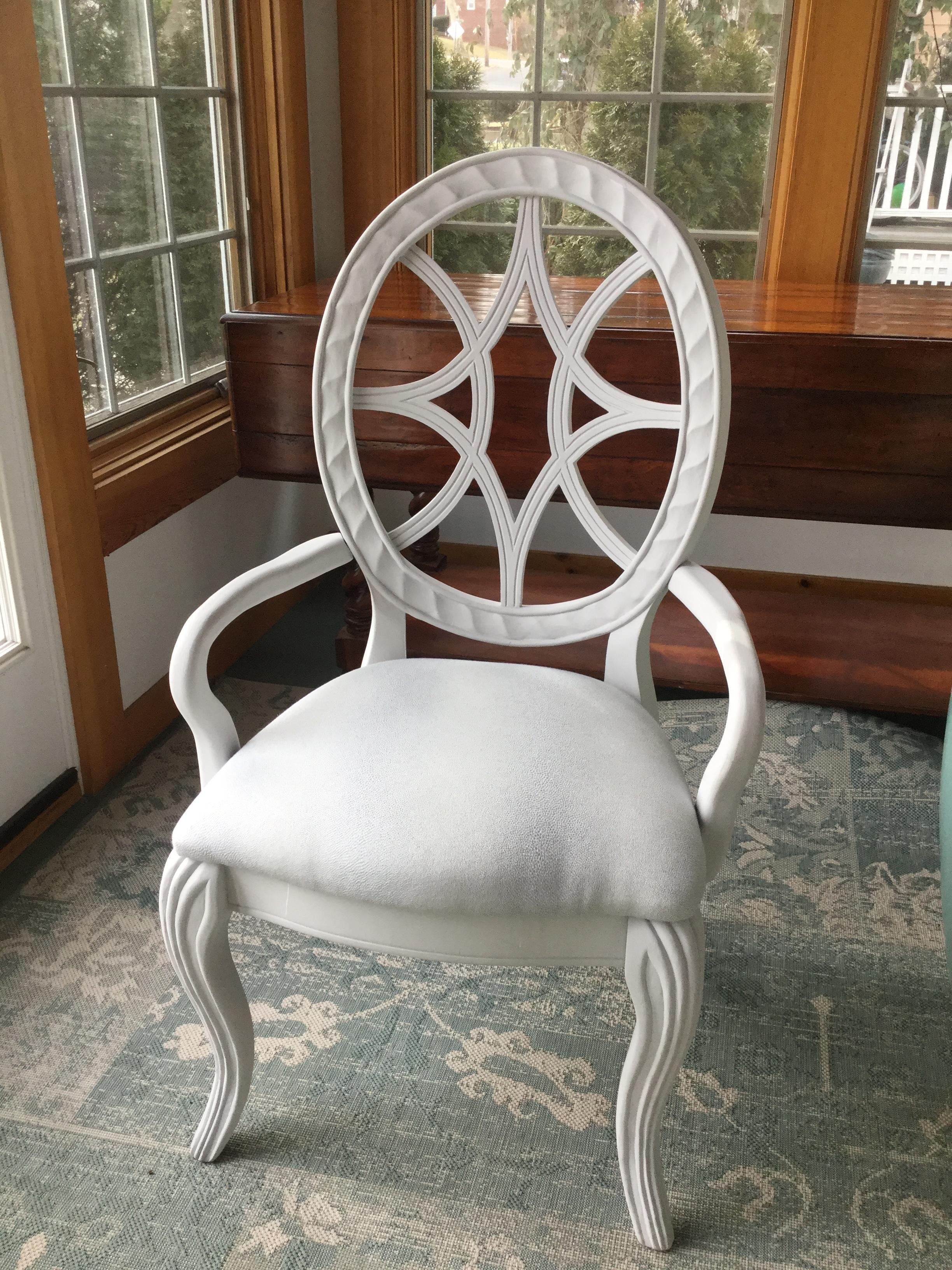 Set of 6 vintage dining chairs having oval backs with pretty decorative fret work, painted a soft dove-grey, newly upholstered in silver grey fabric and resting on elegant cabriole legs.
2 armchairs, 4 side chairs.
Measures: Seat height 18.

 