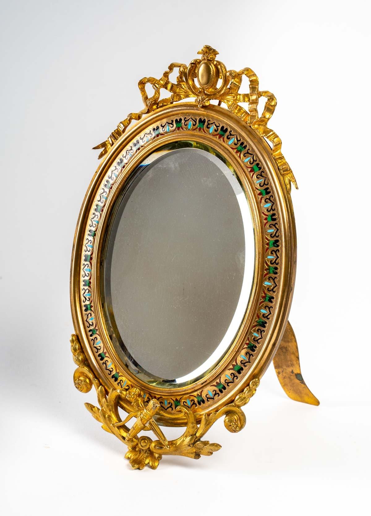 Pretty small table mirror in gold bronze and cloisonné
Louis XV style, in perfect condition
Late 19th century
Measures: Height 26 cm, width 15 cm.