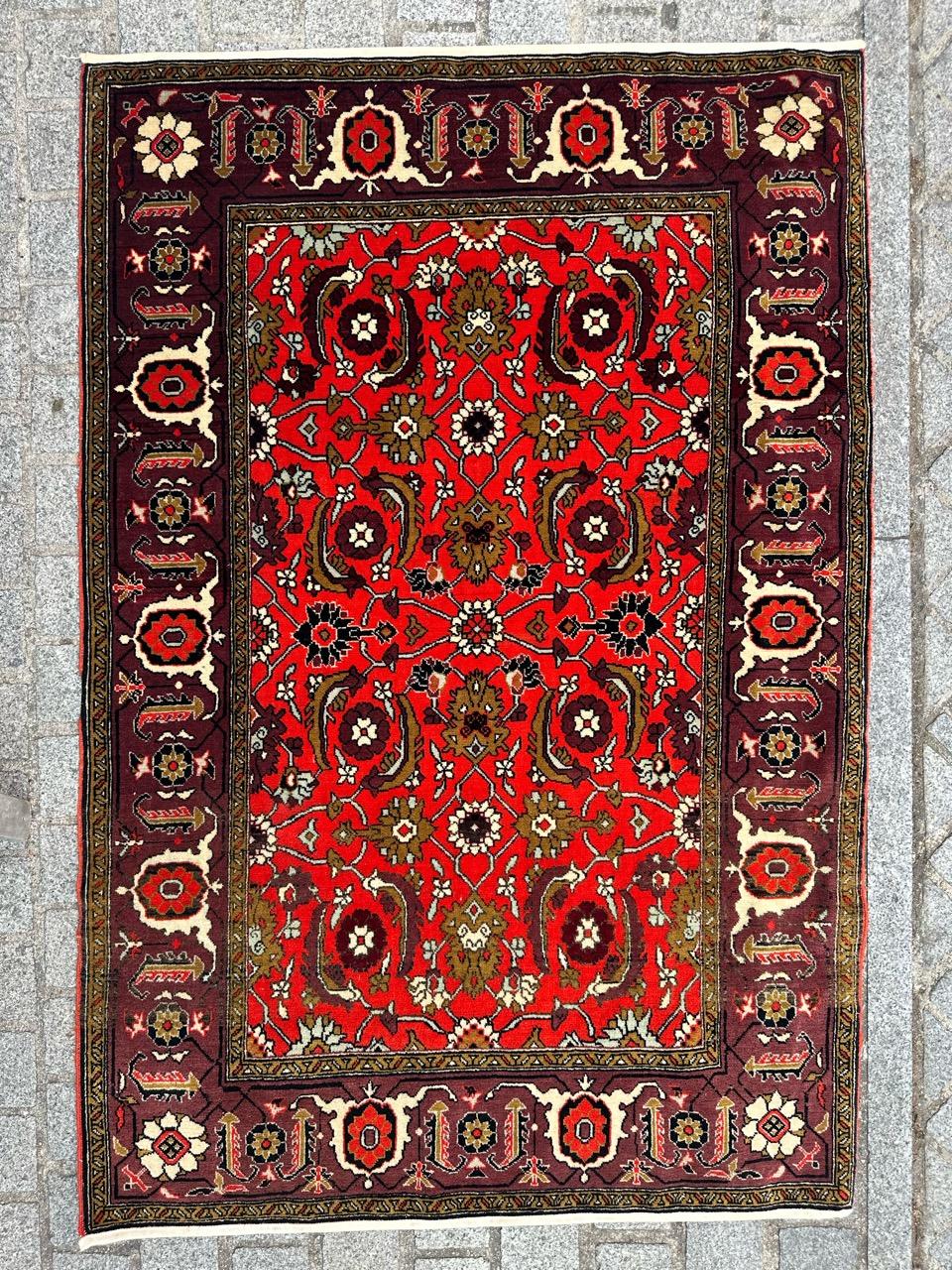 Exquisite midcentury Shirwan Caucasian rug featuring a stunning design inspired by antique Karabagh rugs. This masterpiece boasts vibrant colors and is meticulously hand-knotted with wool velvet on a cotton foundation. The rich red field showcases
