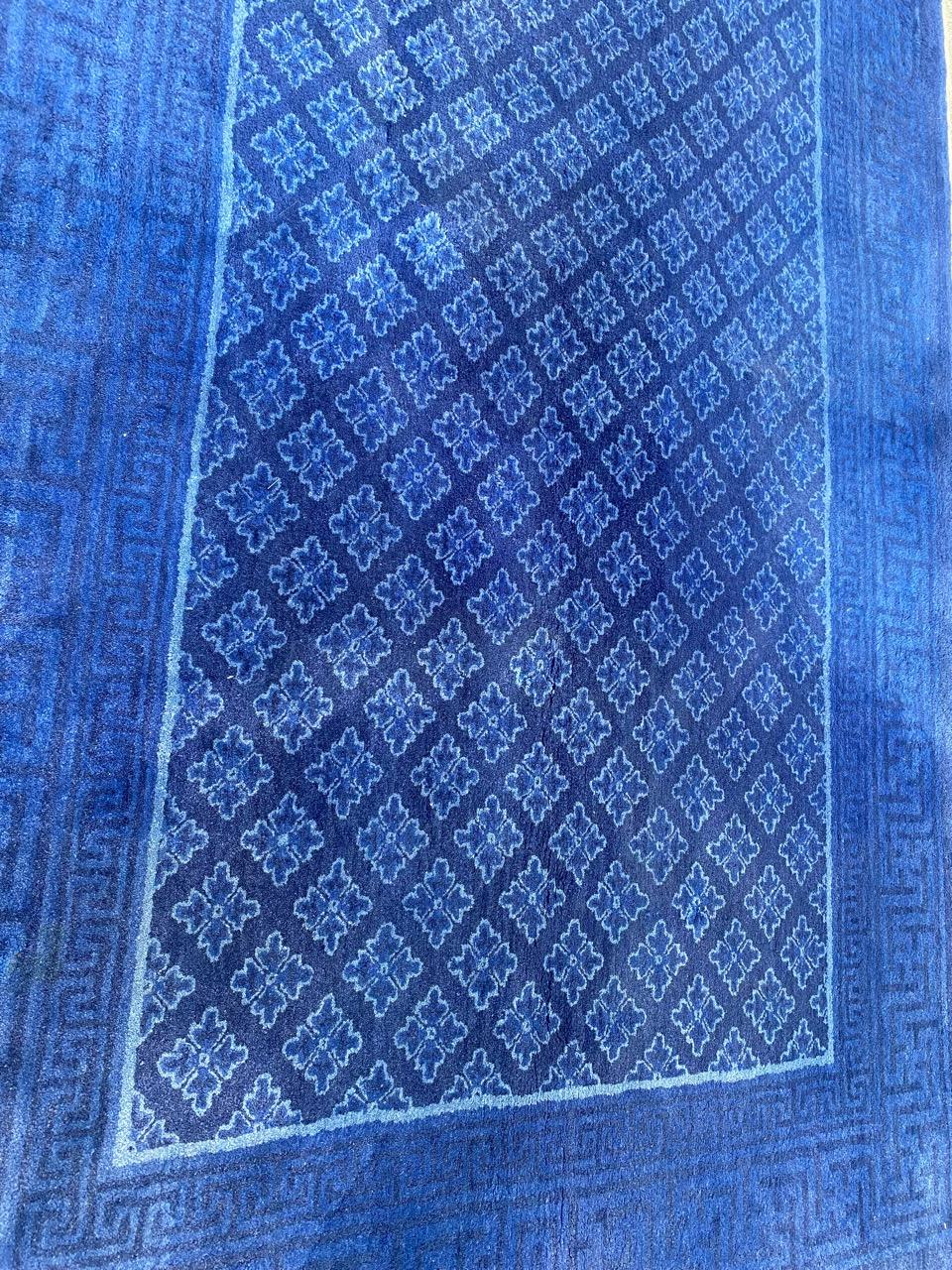Exquisite mid-century blue Chinese rug featuring a captivating antique design, meticulously hand-knotted with wool velvet on a cotton foundation. Elevate your space with this beautiful piece boasting a stunning blue field color. Don't miss out on