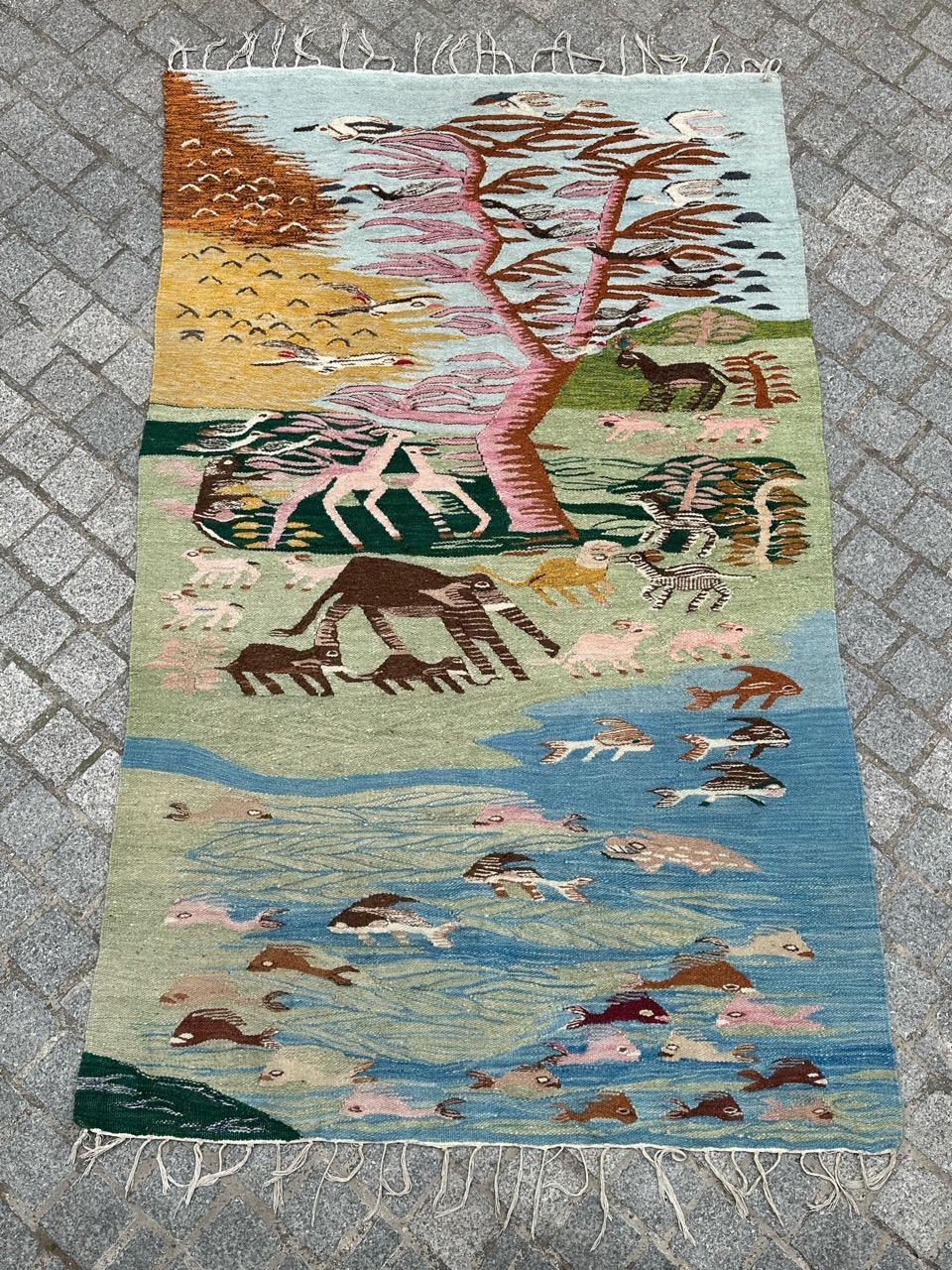 Exquisite midcentury Egyptian tapestry, inspired by the Ramsès Wissa Wassef School Tapestries. Featuring a stunning nature-themed design with animals, birds, and fish, adorned with vibrant colors. Handwoven entirely with wool on a cotton foundation.