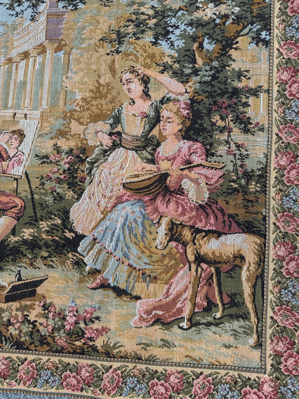“Exquisite tapestry from the late 20th century, crafted in cotton on Jacquard looms by Goblys workshops in France. This Aubusson-style Jacquard tapestry beautifully captures a scene of a countryside luncheon, blending shared moments and the joy of