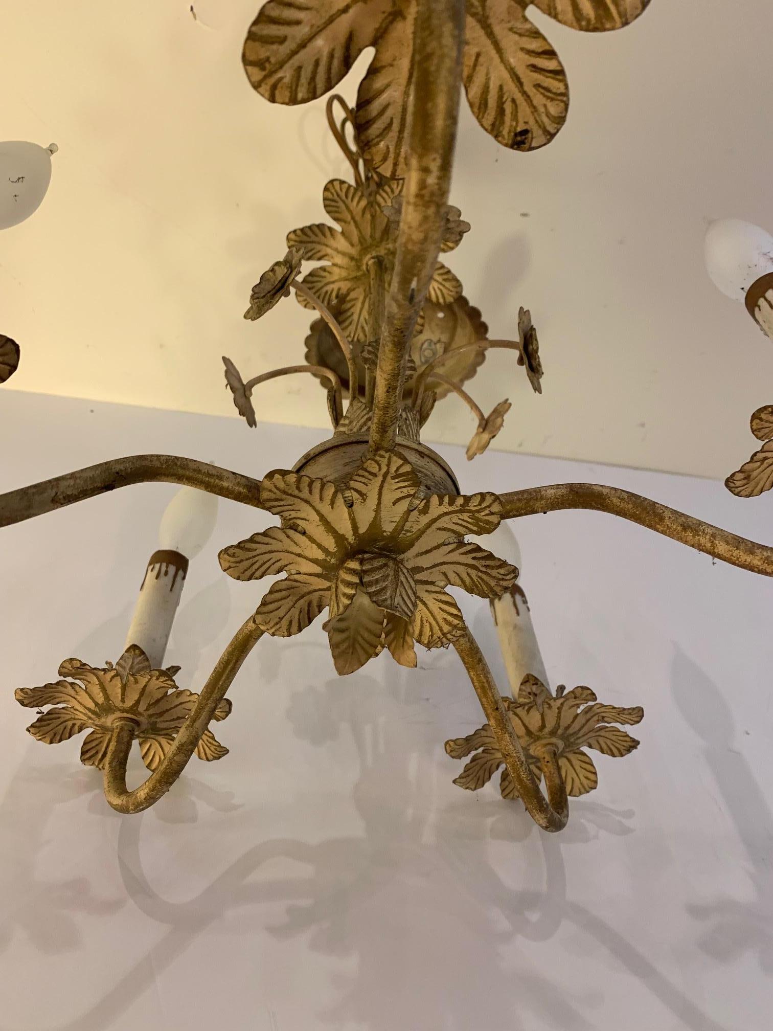 Lovely Italian vintage tole chandelier having pretty acanthus leaf decoration and flowers. There are 6 arms and matching ceiling canopy.