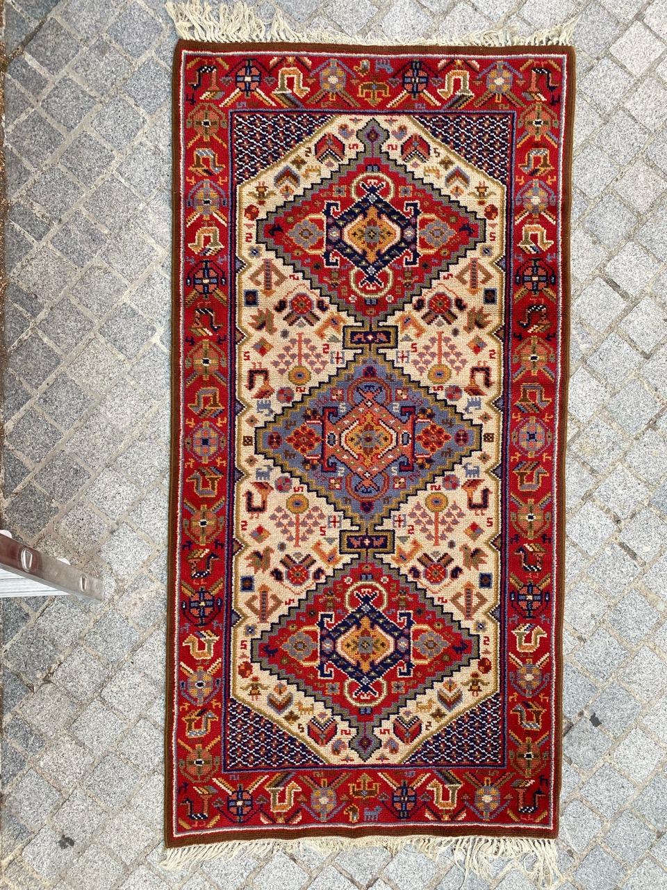 Beautiful French Rug from the mid-20th century. This rug is a masterpiece, meticulously knotted with wool on a cotton and jute foundation. It features a stunning Persian design inspired by Shiraz, showcasing intricate red-dark blue and light