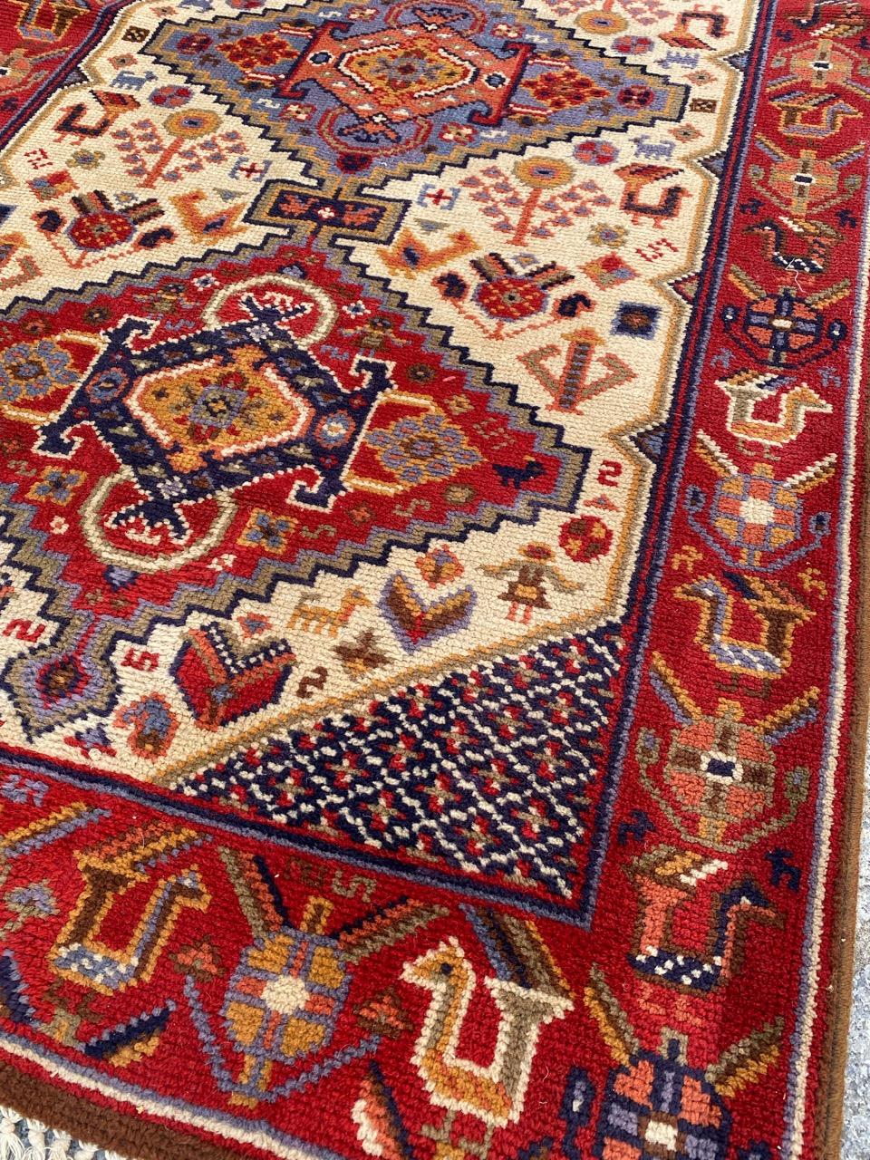 Beautiful French Hallway Rug from the mid-20th century. This rug is a masterpiece, meticulously knotted with wool on a cotton and jute foundation. It features a stunning Persian design inspired by Shiraz, showcasing intricate red-dark blue and light