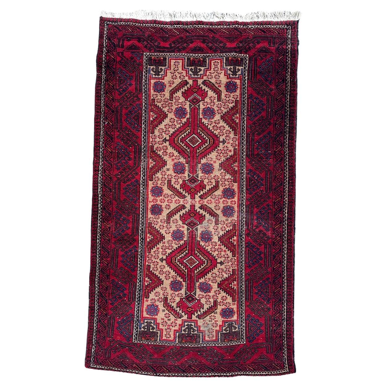 Pretty vintage tribal Baluch rug