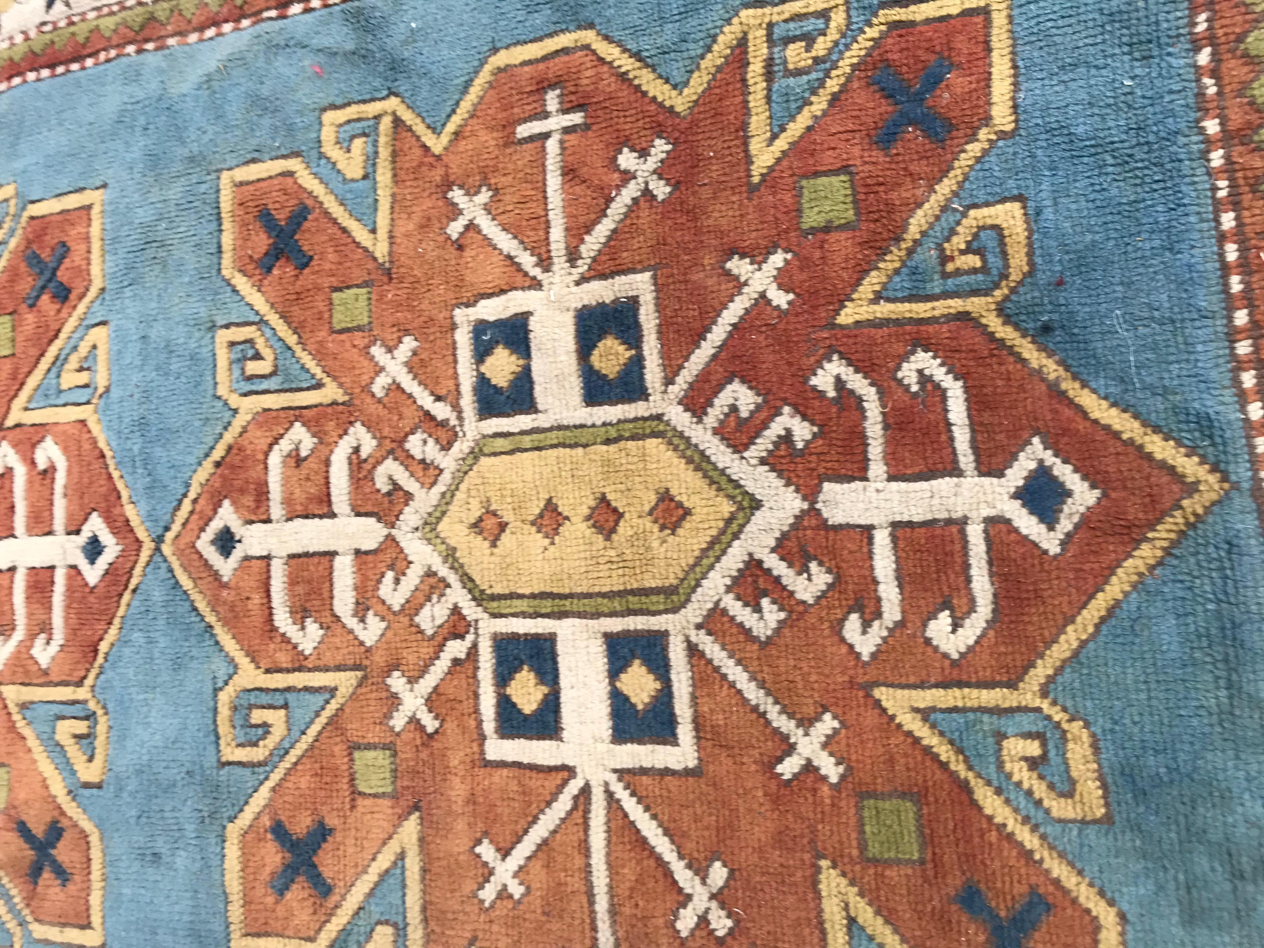 Beautiful vintage Turkish Kars with a nice Kazak design, and beautiful colors with a blue sky field and orange colors, entirely hand knotted with wool velvet on wool foundation, mid-20th century all wool, in good conditions.

   