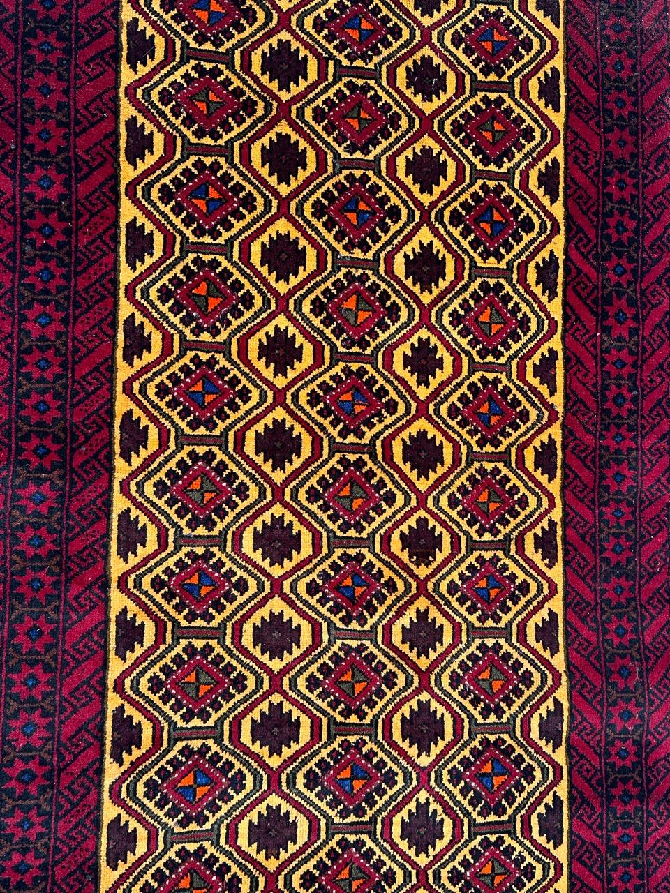 Pretty vintage Turkmen rug with nice tribal and geometrical design and nice colours with yellow background and red, black, green, orange and blue on design, entirely hand knotted with wool on cotton foundation. 
Small wears at one extremity