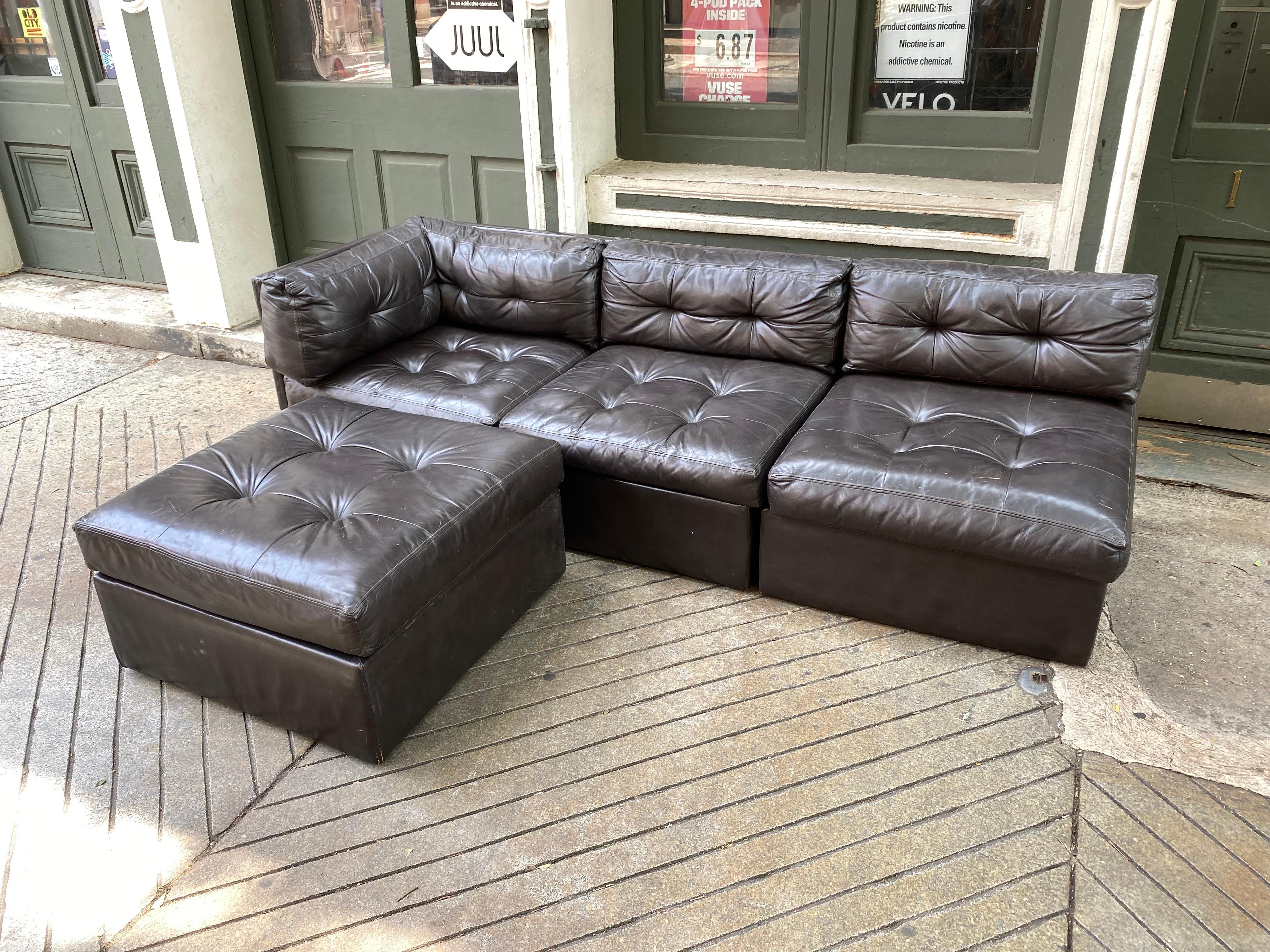 3 Piece Brown Leather Sectional Sofa by Preview. Ottoman is 30