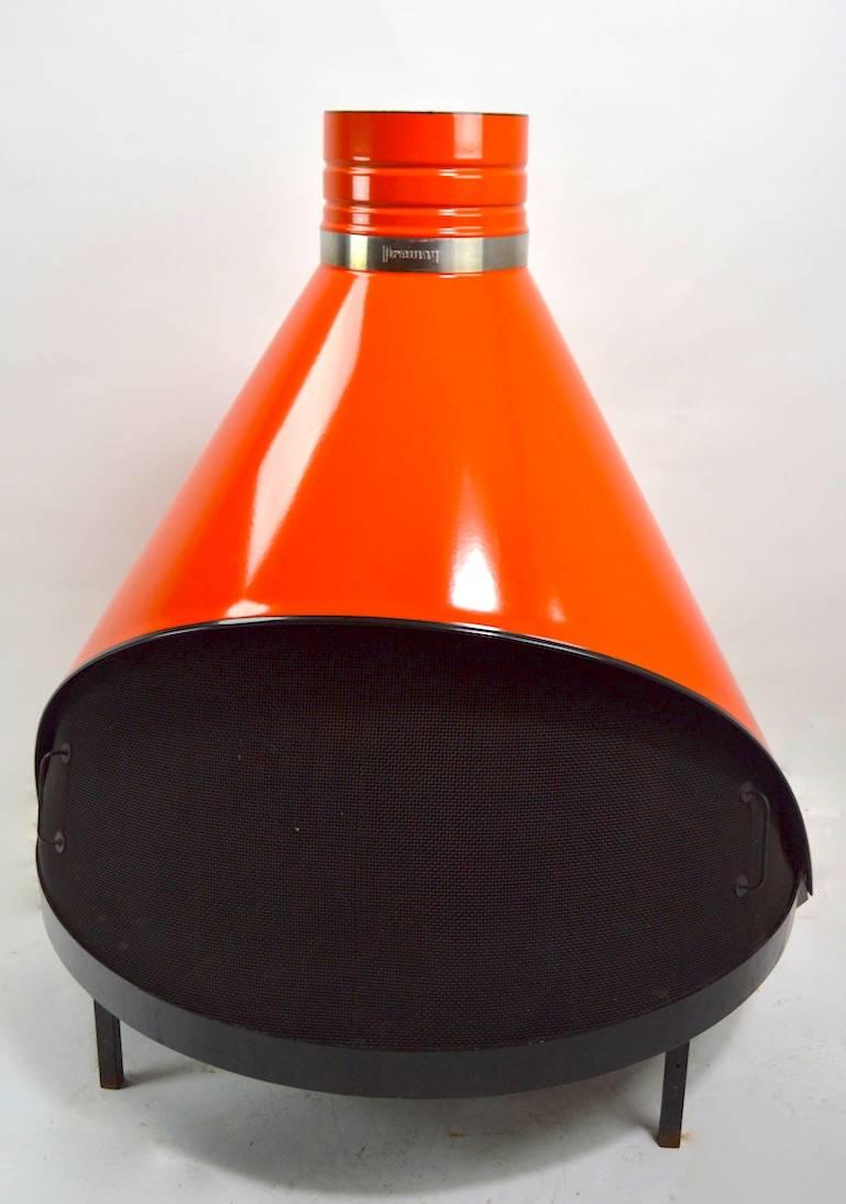 Orange enamel Preway cone form fireplace in extra fine original condition. This example comes with two exhaust tubes, (each tube 32 inch) a curved elbow joint, and the original wall washer ring. Unusual to find these in such fine condition, clean,