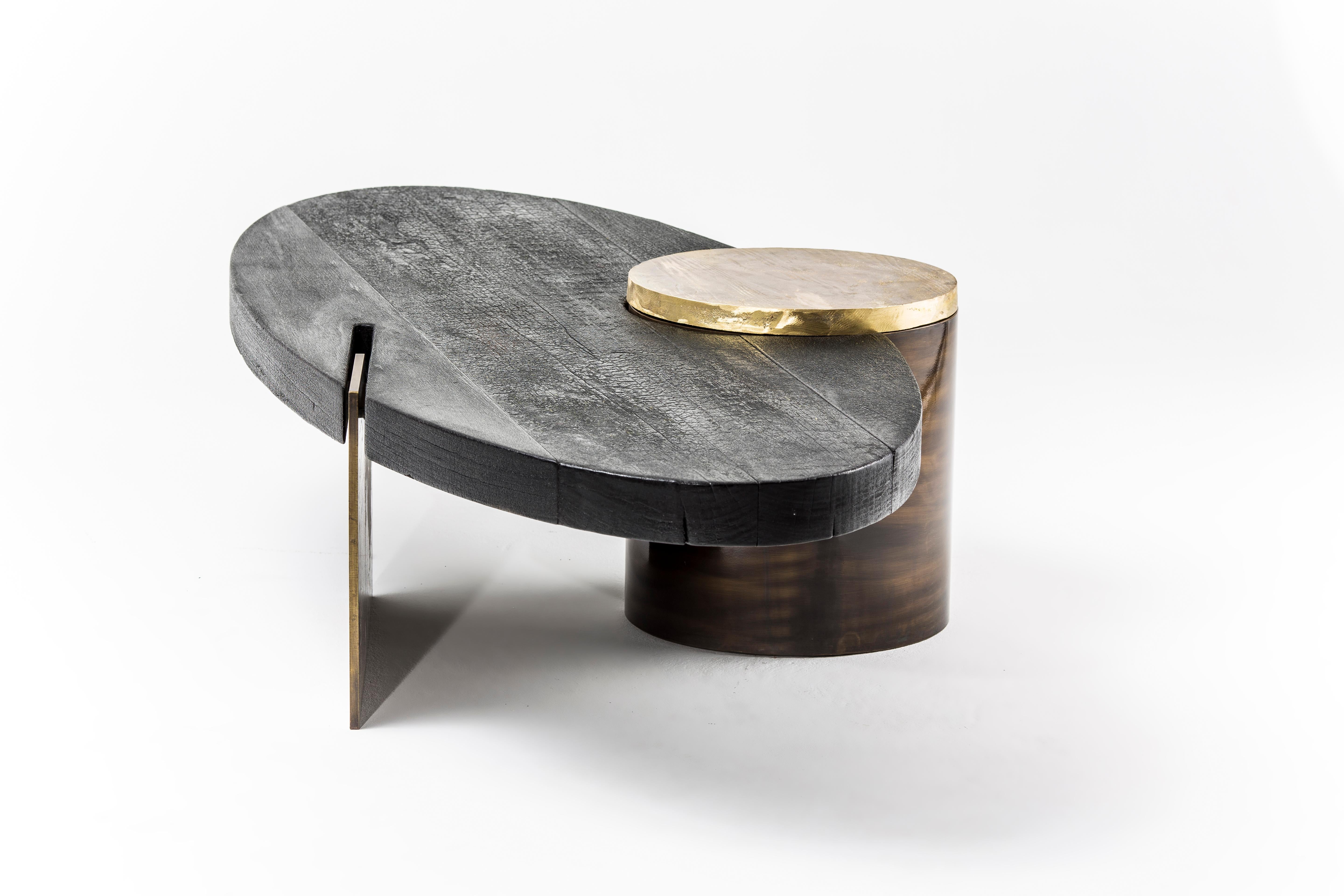 Primal coffee table by Egg Designs
Dimensions: 180 L X 80 D X 40 H cm
Materials: shou sugi ban hardwood, solid cast brass, bronze coated steel, brass

Founded by South Africans and life partners, Greg and Roche Dry - Egg is a unique perspective