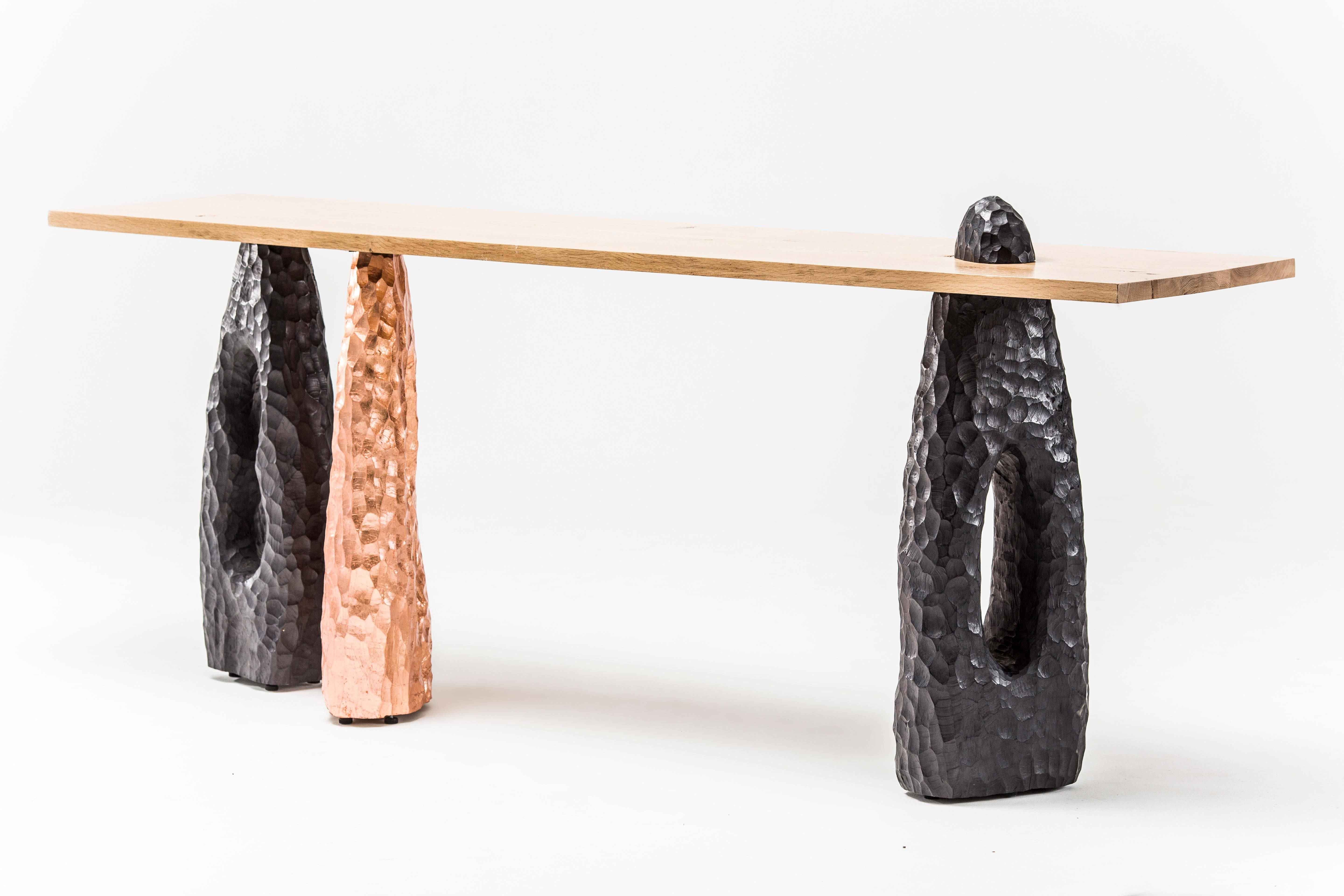 Primal Console by Egg Designs
Dimensions: 240 L X 50 D X 88 H cm
Materials: French oak top, chiselled burnished black leg, copper leaf

Founded by South Africans and life partners, Greg and Roche Dry - Egg is a unique perspective in contemporary