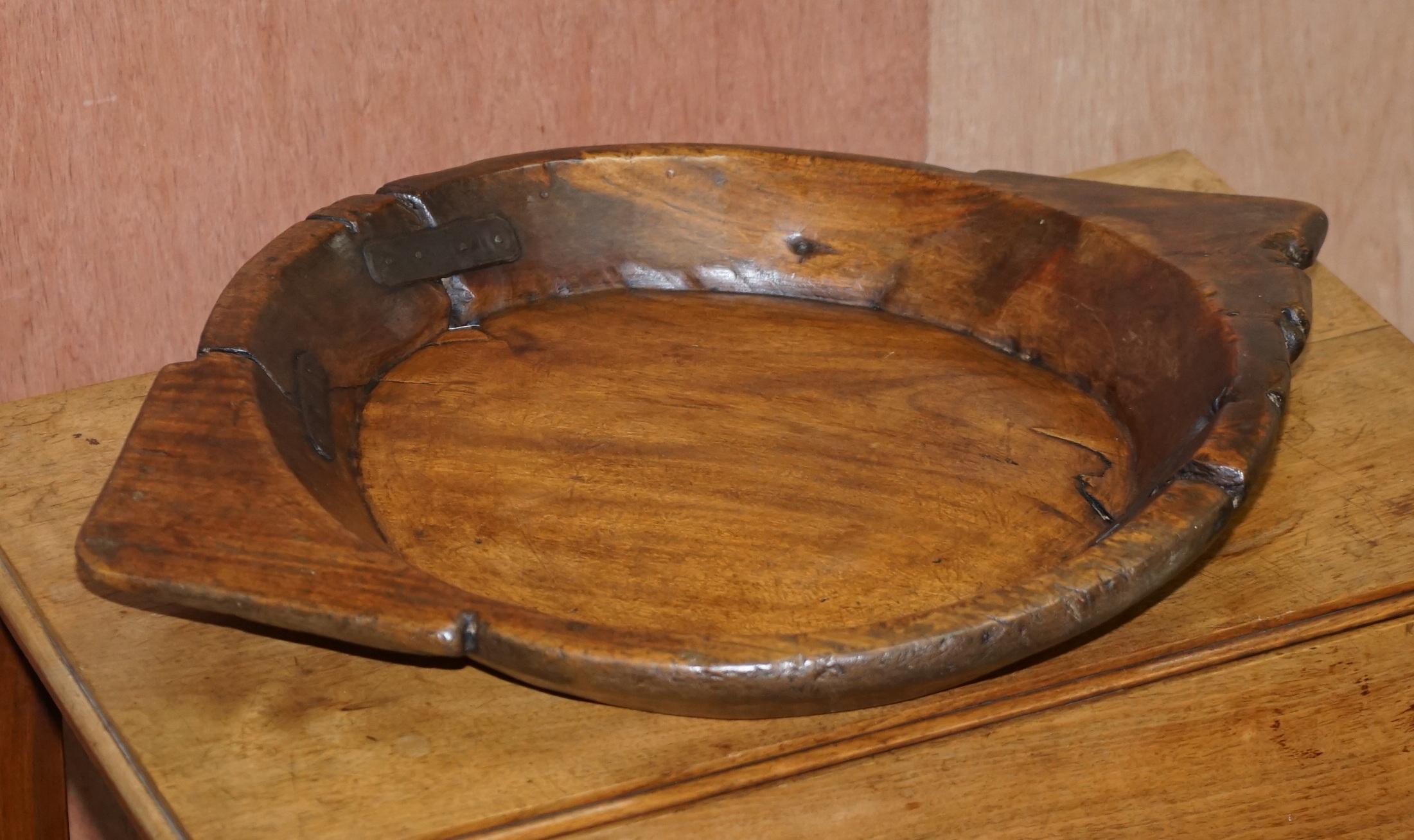 We are delighted to offer for sale this lovely primate circa 1850 French walnut large fruit bowl with period metal strap work repairs

A very good looking and decorative bowl, the timber shape and repairs tell the story of a long and happy