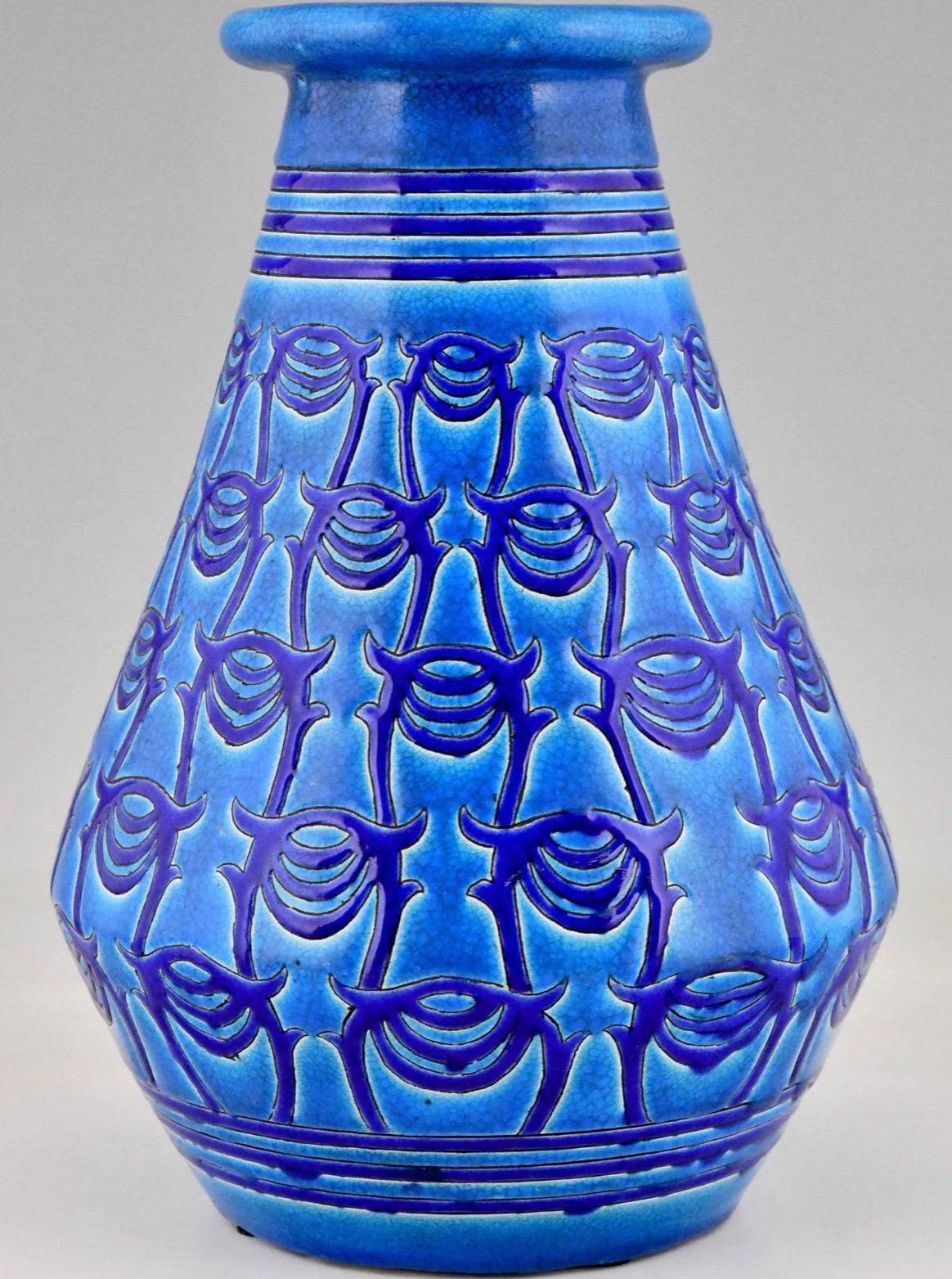 Blue Art Deco vase, made of ceramics. Atelier Primavera, Longwy.  France, 1927. This vase was designed in 1919.
“Les Grands Magasins du Printemps” is a fine Longwy Primavera Art Deco ceramic vase. Longwy made this French Art Deco vase for Atelier