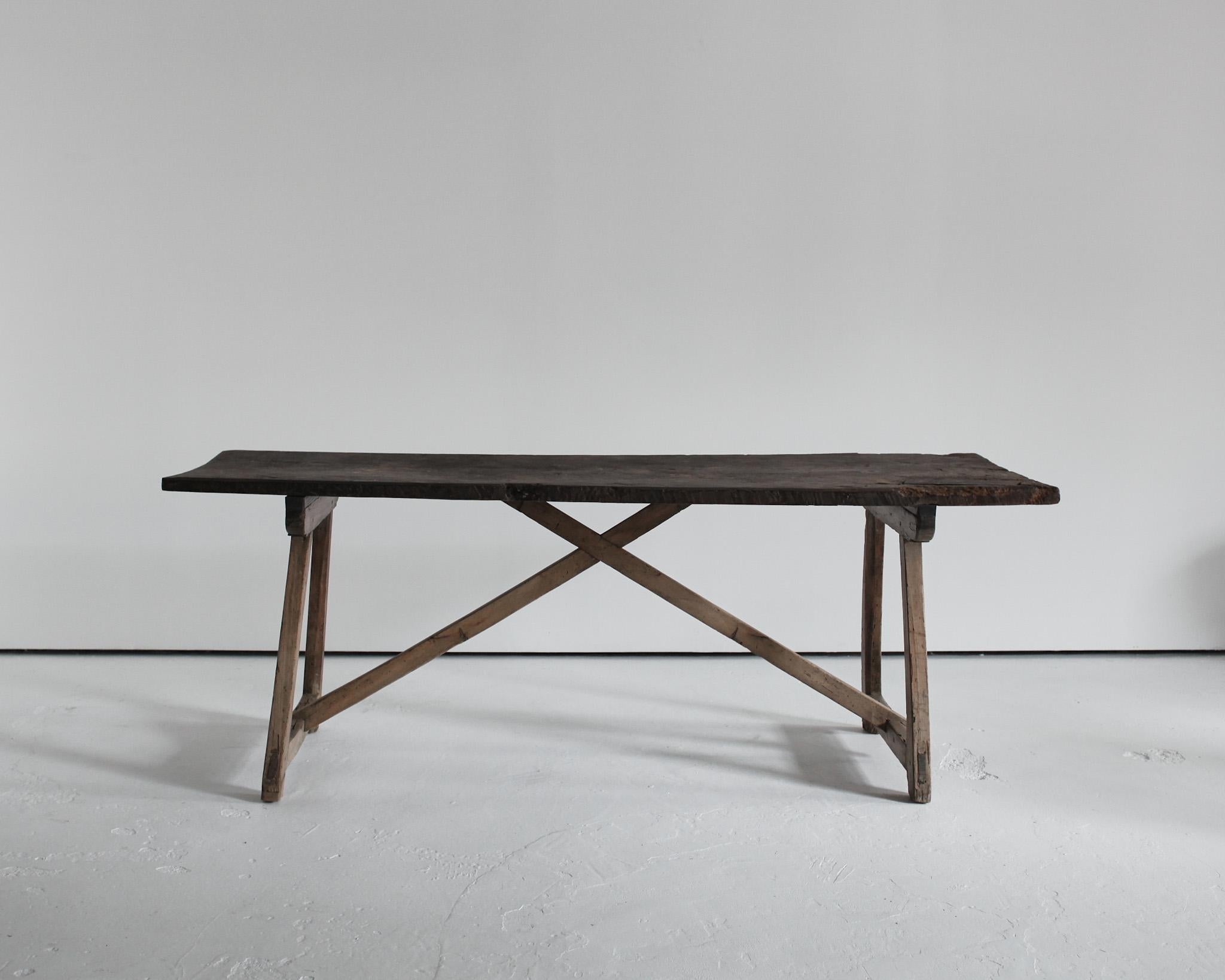 A good sized primitive Catalan dinning table.

 

19th century Pine base with 18th century. Chestnut top.

 
Many age old repairs.

 
Heavily Patinated.

-

We offer free shipping to Canada/USA through Fedex with this item.