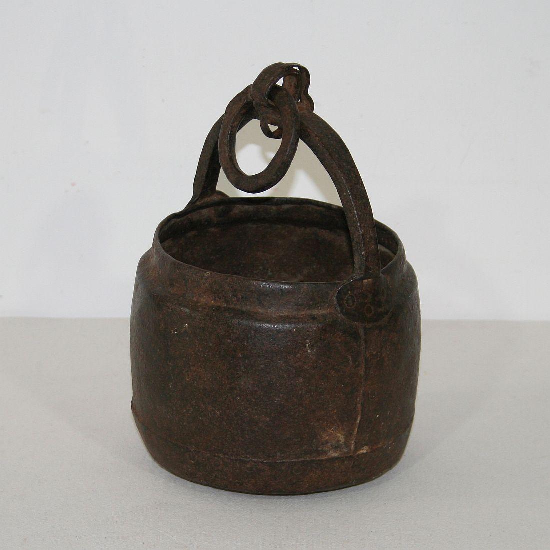 Rare and primitive hand forged iron cooking pot, India, 18th century. Weathered, small losses and old repairs.