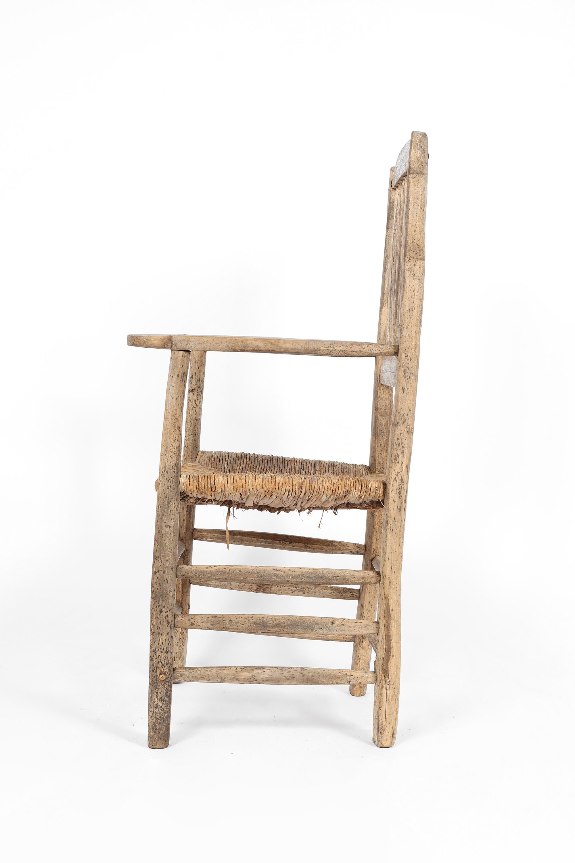 Irish Primitive 19th Century Elm & Rush Chair For Sale
