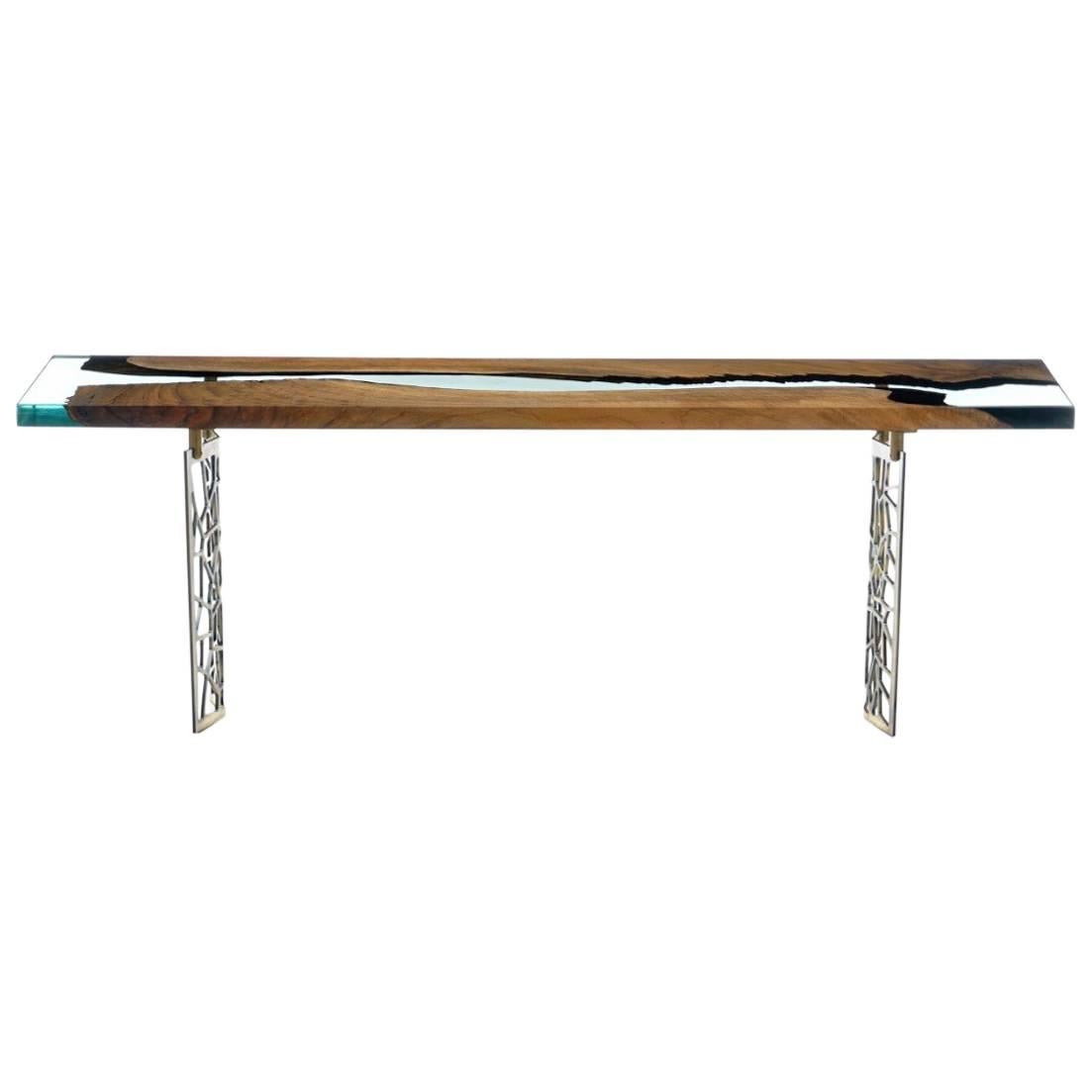 The ‘Primitive 200 Resin Console’ was made in Ankara, Turkey with walnut wood cut into straight edges. It is kilned and dried prior to being filled with high quality resin and placed on steel base. This particular piece is ideal for entryways!