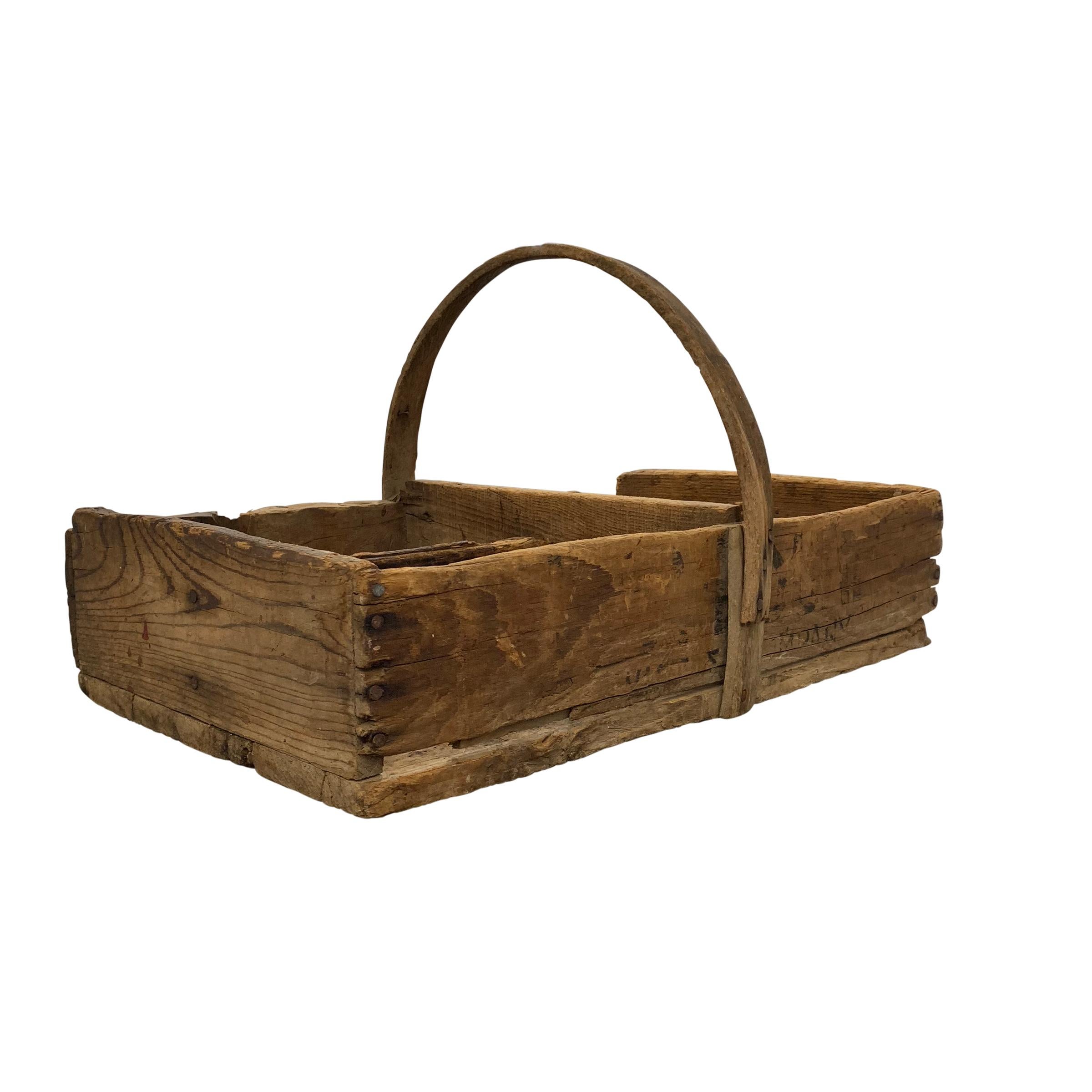 A Primitive early 20th century American wooden tool box with a bentwood handle and divided into four sections. The wear and patina are excellent!