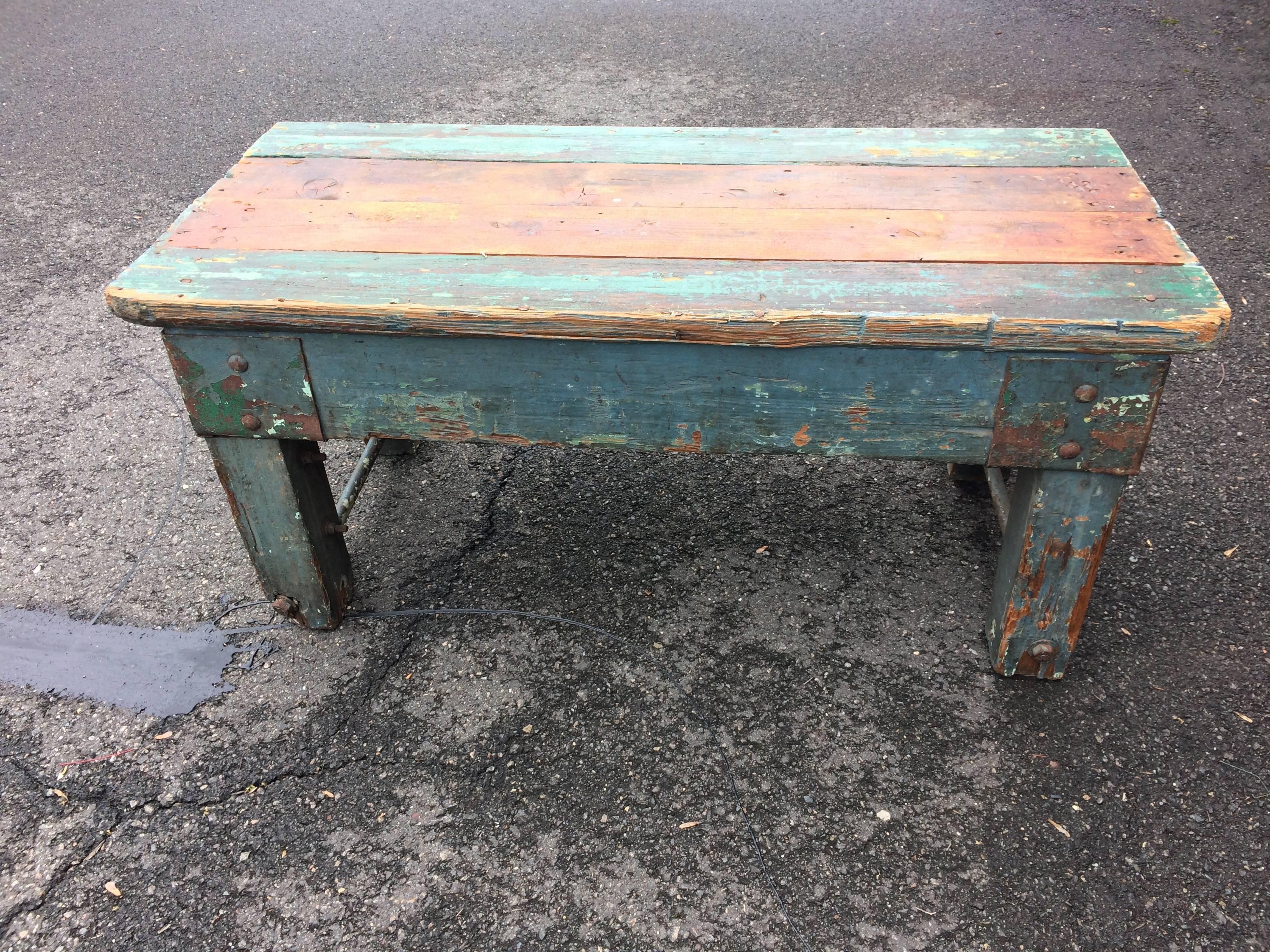 One of a kind rustic coffee table made from reclaimed wood with original paint in eye popping shades of turquoise, light green, grey blue and natural honey colored wood. Cool chunky apron, legs and screws. Rough on the feet and on edges.
CT