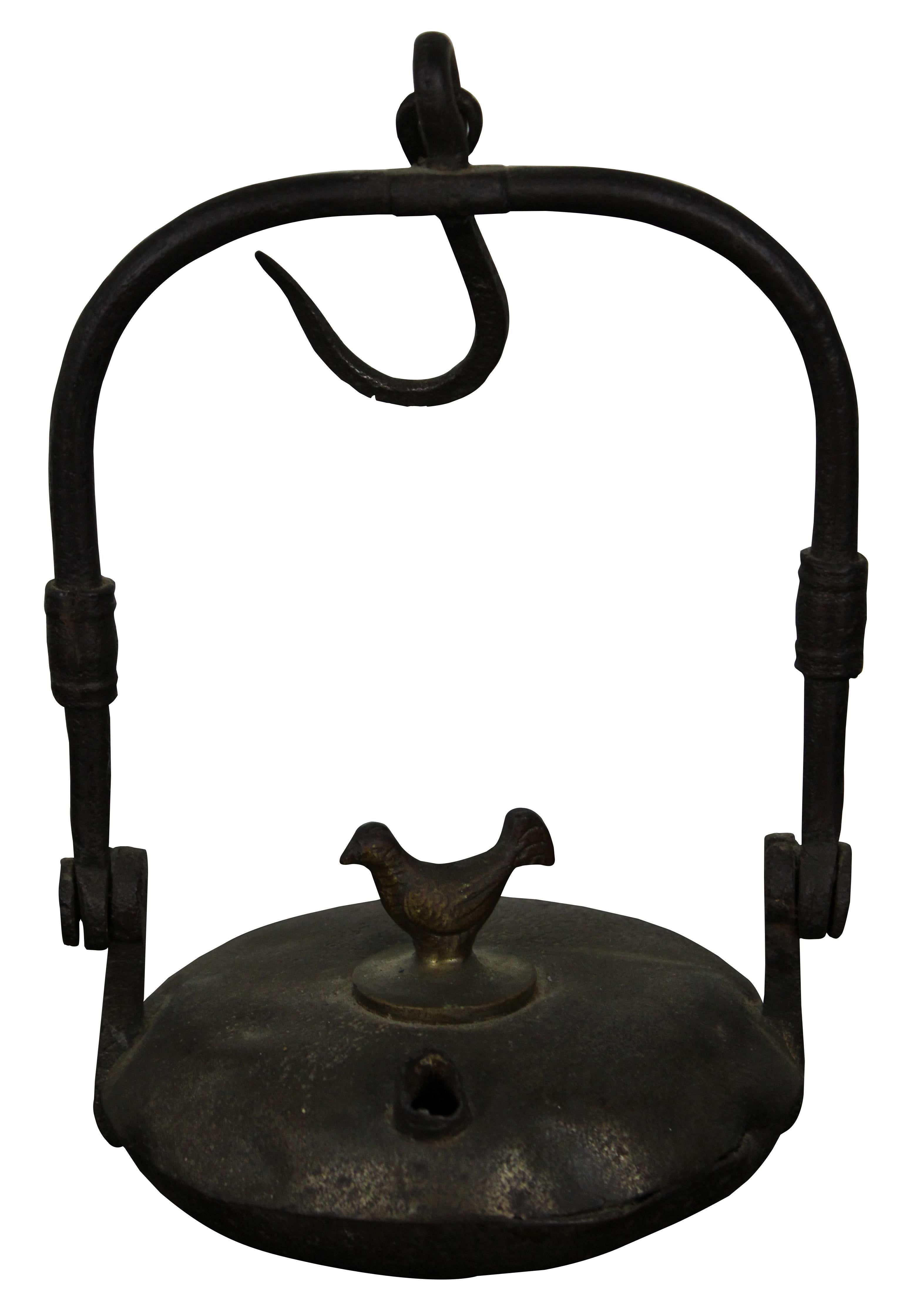 Antique early 18th century French miner’s whale oil lantern, decorated with a brass rooster and iron handle/hook.