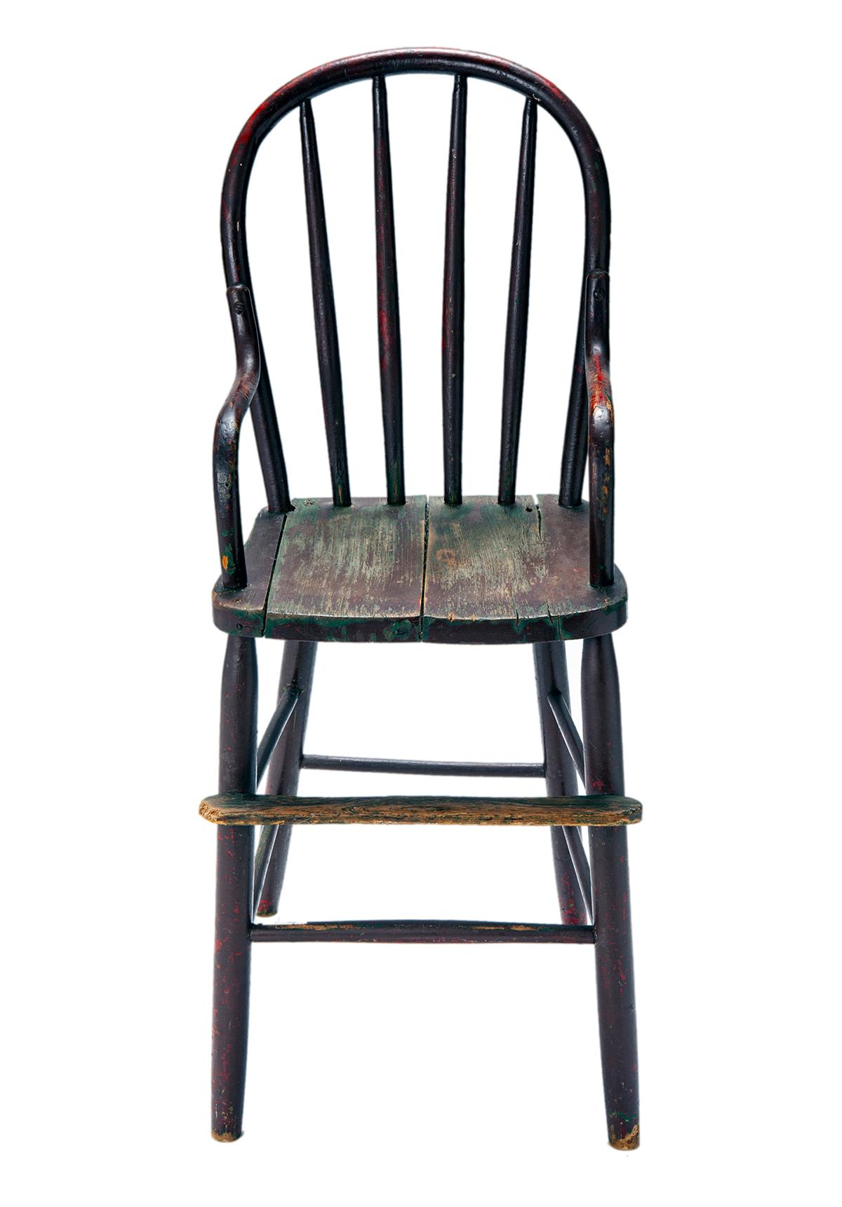 Late 19th century bentwood child's high chair with bentwood arms & platform footrest. The chair is exceptionally well made. It is solid, sturdy and does not wobble. The paint is in distressed condition. 
The underside is not marked or