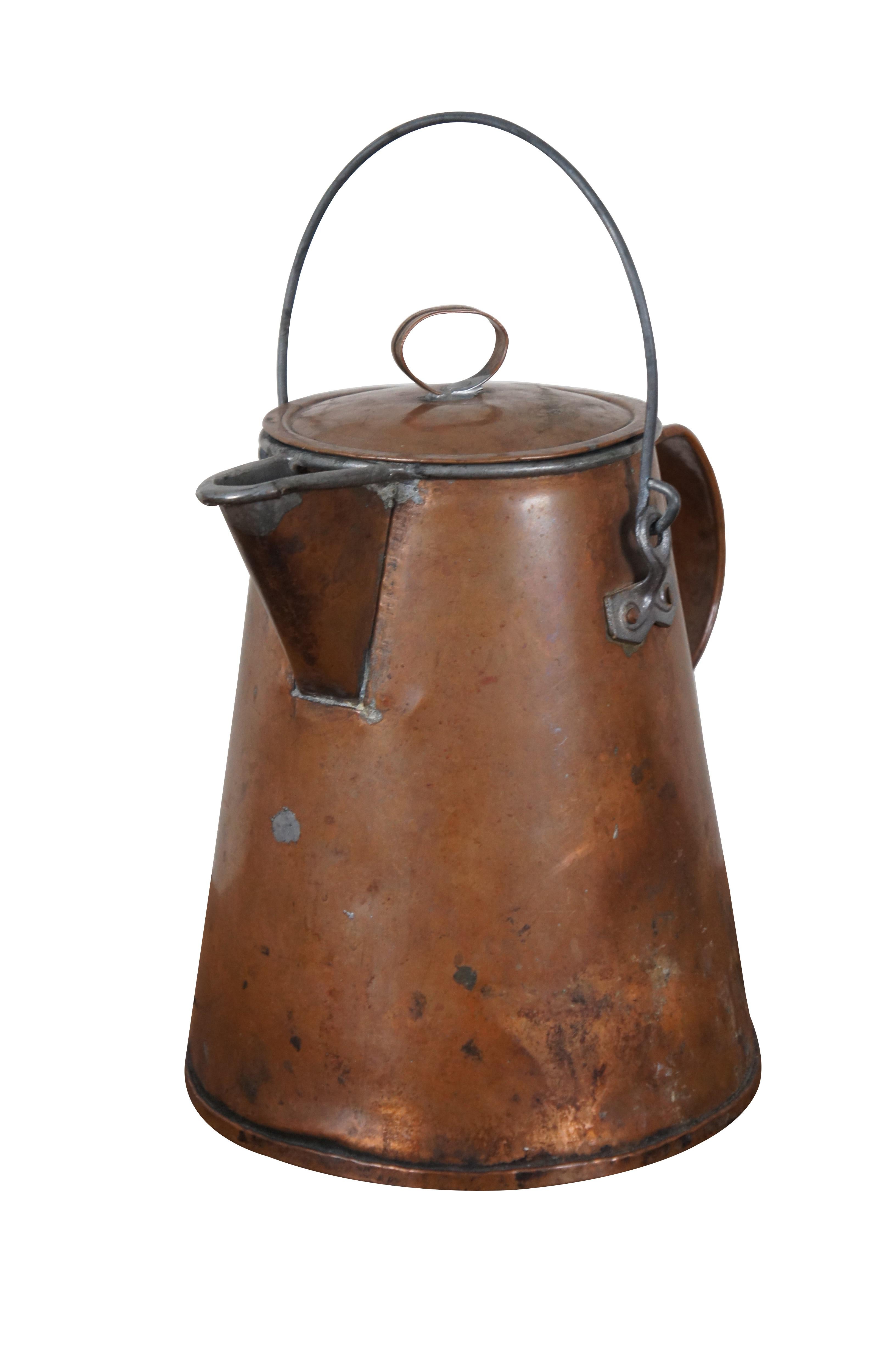 Antique copper teapot / coffee pot featuring primitive styling with nice handles and lid.

Dimensions:
10.75