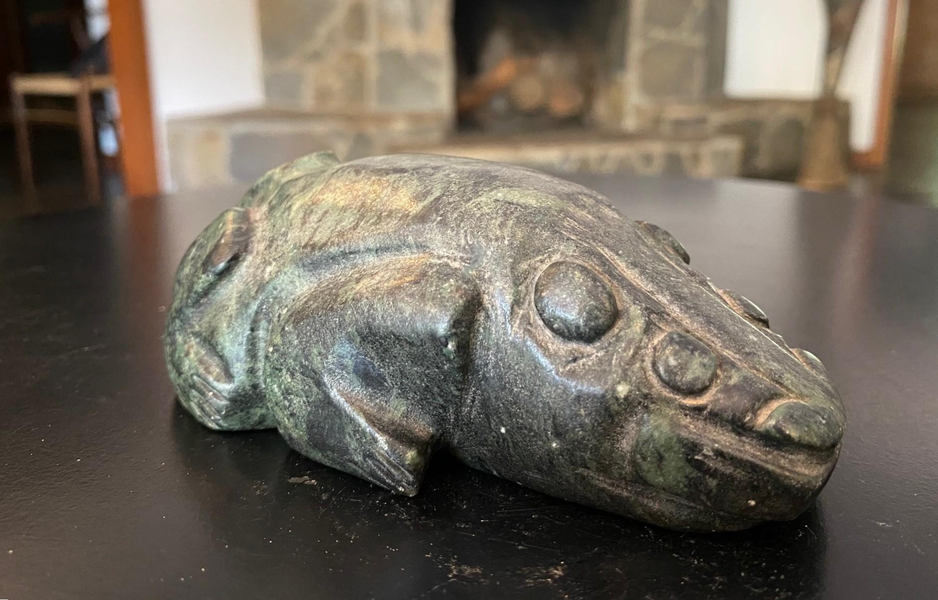An interesting and rather unusual indigenous native North or Central/South American (Mesoamerican) primitive stone carved (steatite or soapstone) mythical creature figure.  We are not sure exactly where this piece is from.  It has elements of