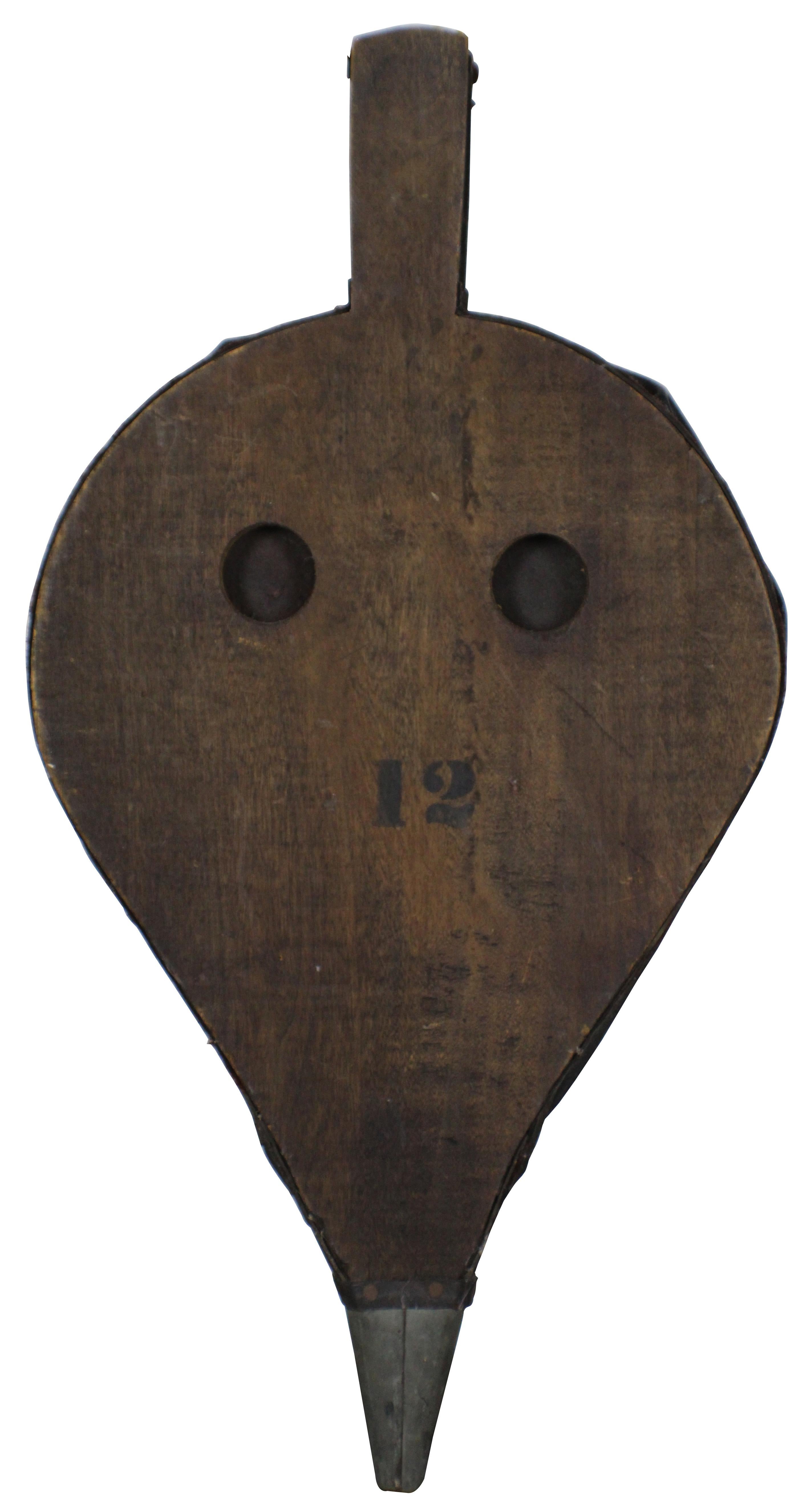 Antique oak and leather fireplace bellows; marked 12 on one side. Measure: 23
