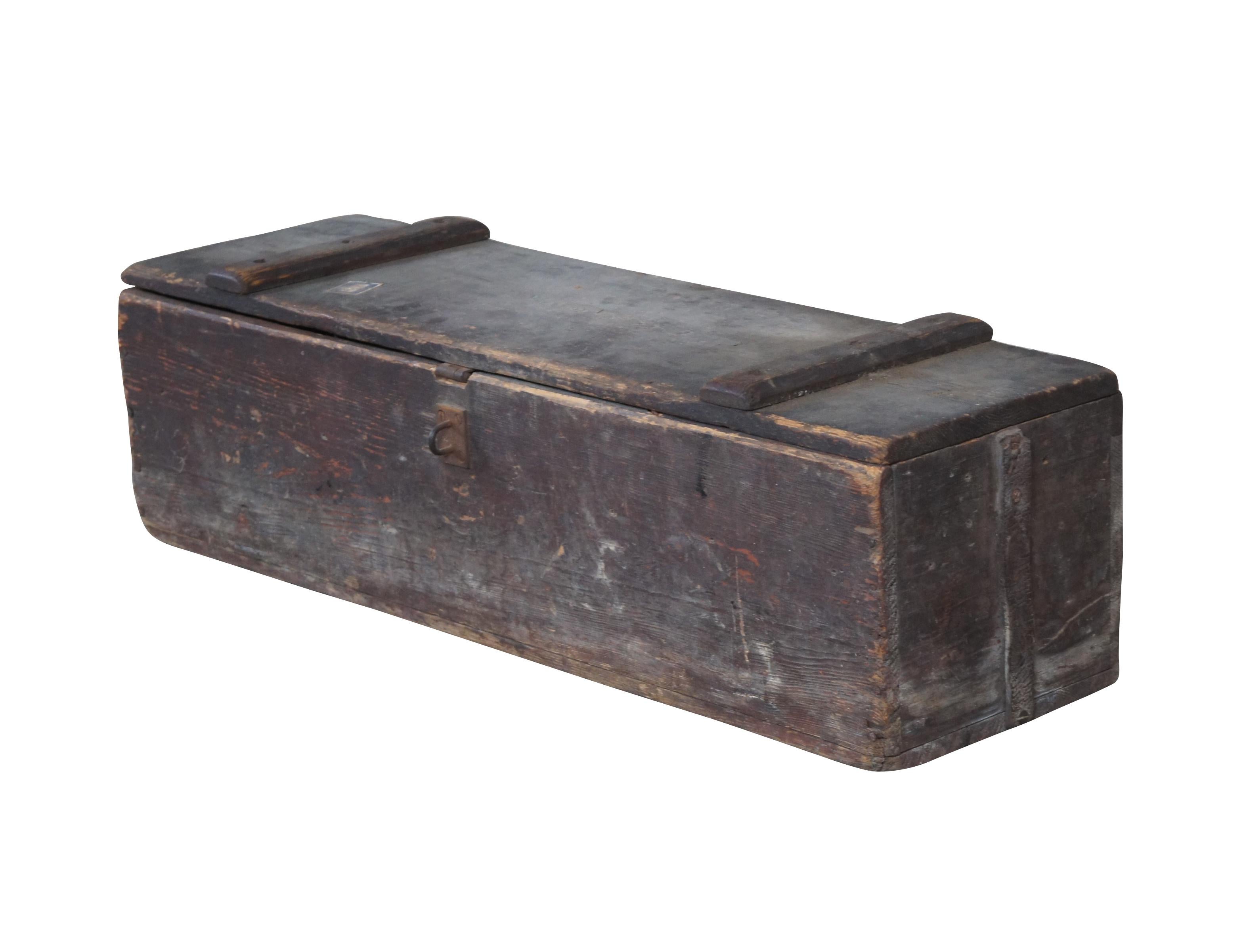 An antique tool box. Made from pine with iron hardware. Size: 32
