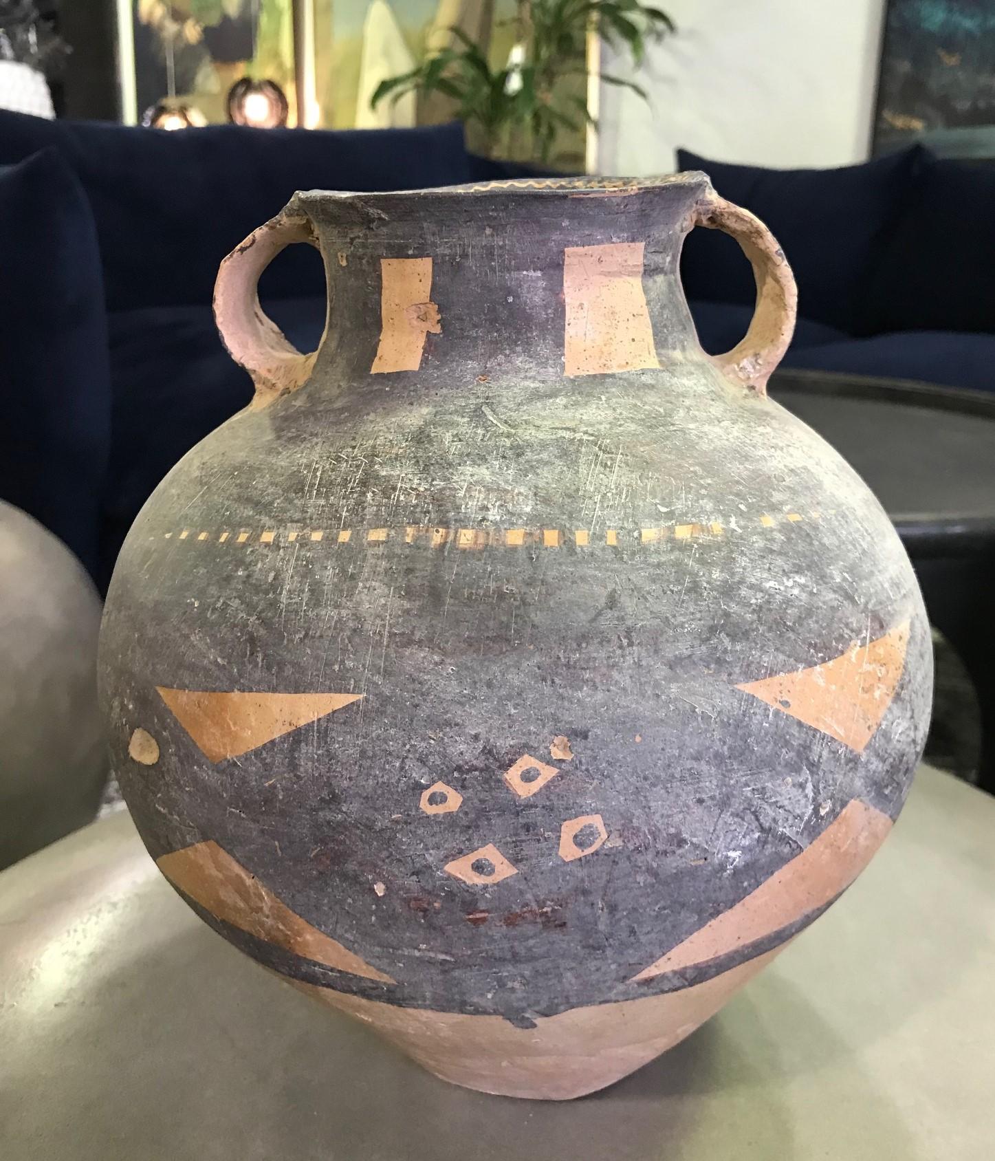 A rather wonderful and unusual large ceramic piece. Well crafted and beautifully decorated with what appears to be primitive or tribal symbols. 

We have tried to place its exact origins but aren't quite sure where this piece is from. We are