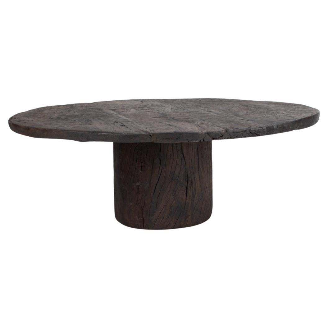 Primitive Belgian Coffee Table in Solid Oak, circa 1900
A striking primitive-style coffee table composed of authentic reclaimed oak elements dating to the transition period around 1900. This sculptural Belgian piece is assembled from two original