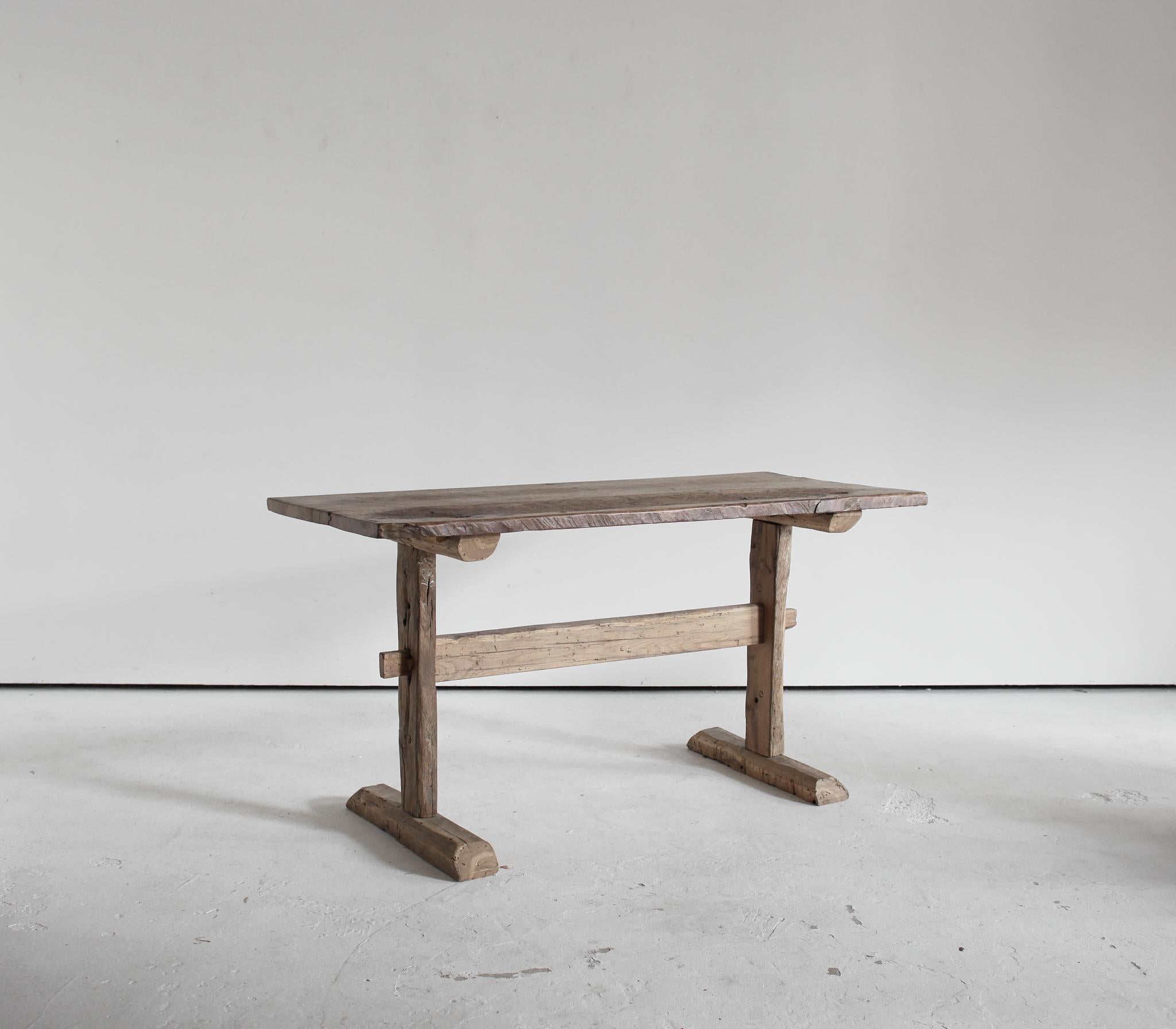 A small 6 seater mountain dinning table constructed in our London workshop from slabs of 18th C. Catalan walnut.

Heavily patinated with many age old repairs.