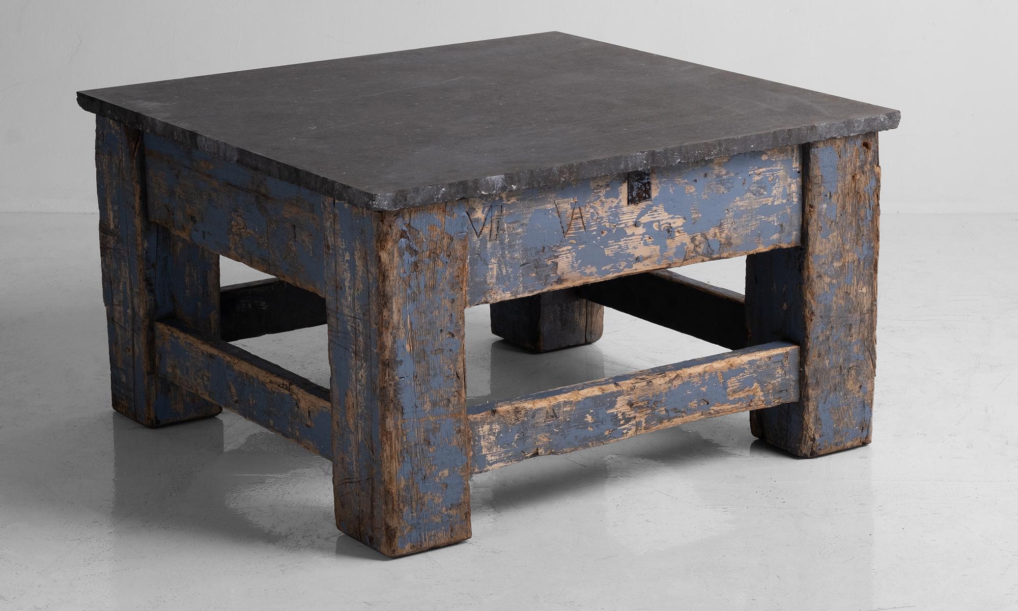 Beautiful stone top on robust wooden base with remnants of original paint.