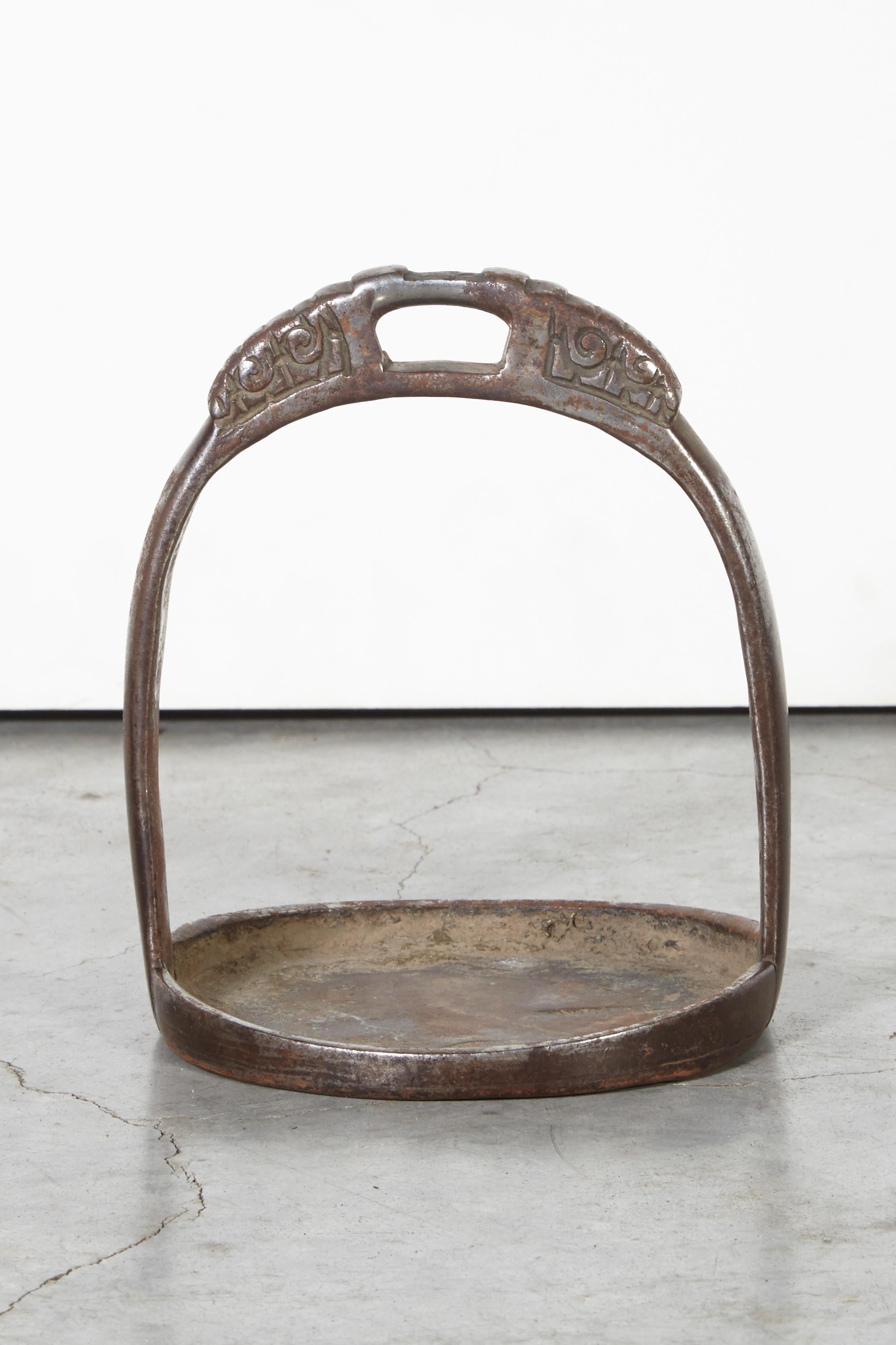 A beautifully cast bronze stirrup from Tibet, circa 1880. The simple lines and alluring wear of this stirrup make this a wonderful object and a great conversation piece. Perfect to hold keys, change or jewelry.