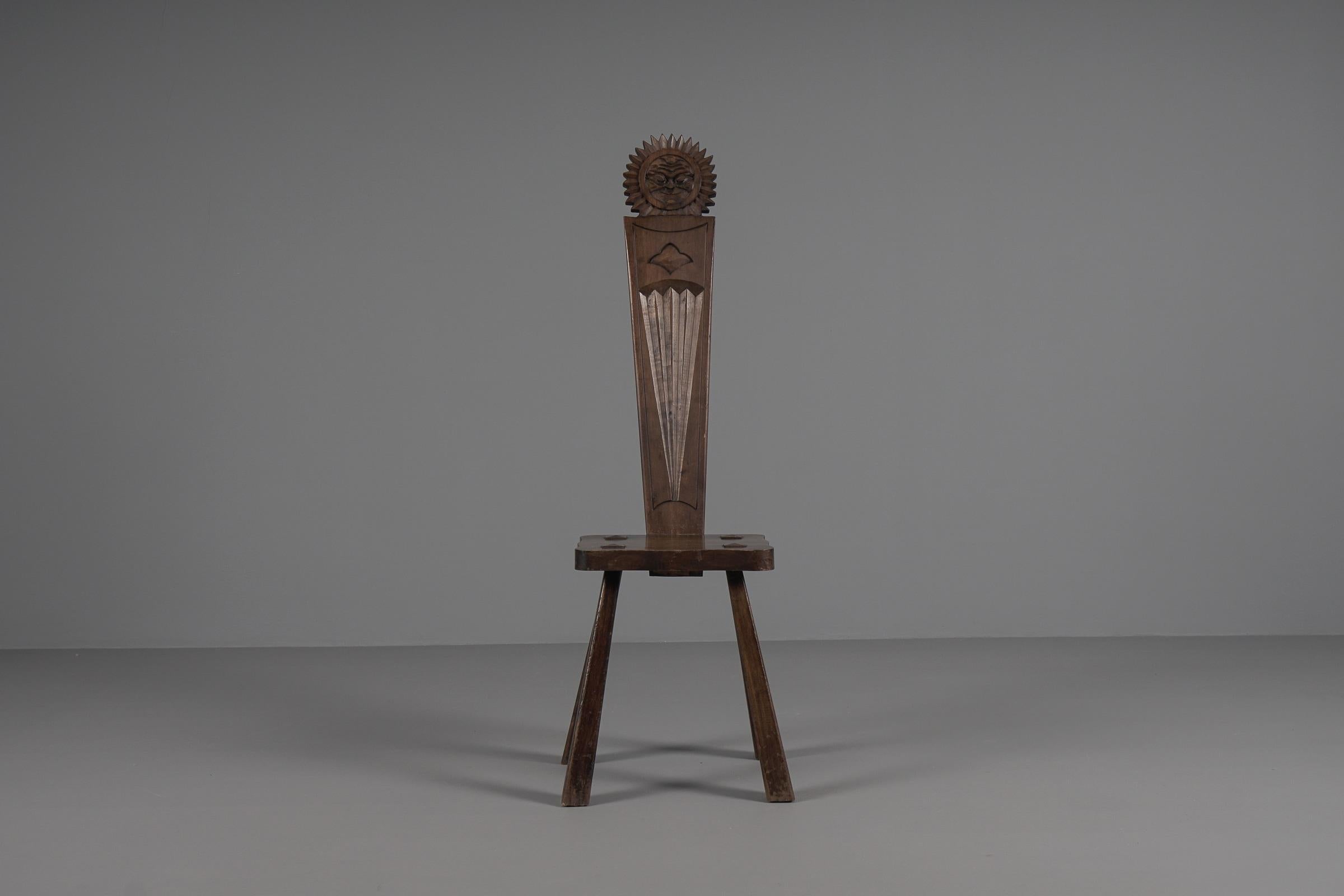 Solid hand carved sculptural wooden chair from the 1940s / 1950s. 

Seat height 40cm, total height 112cm.