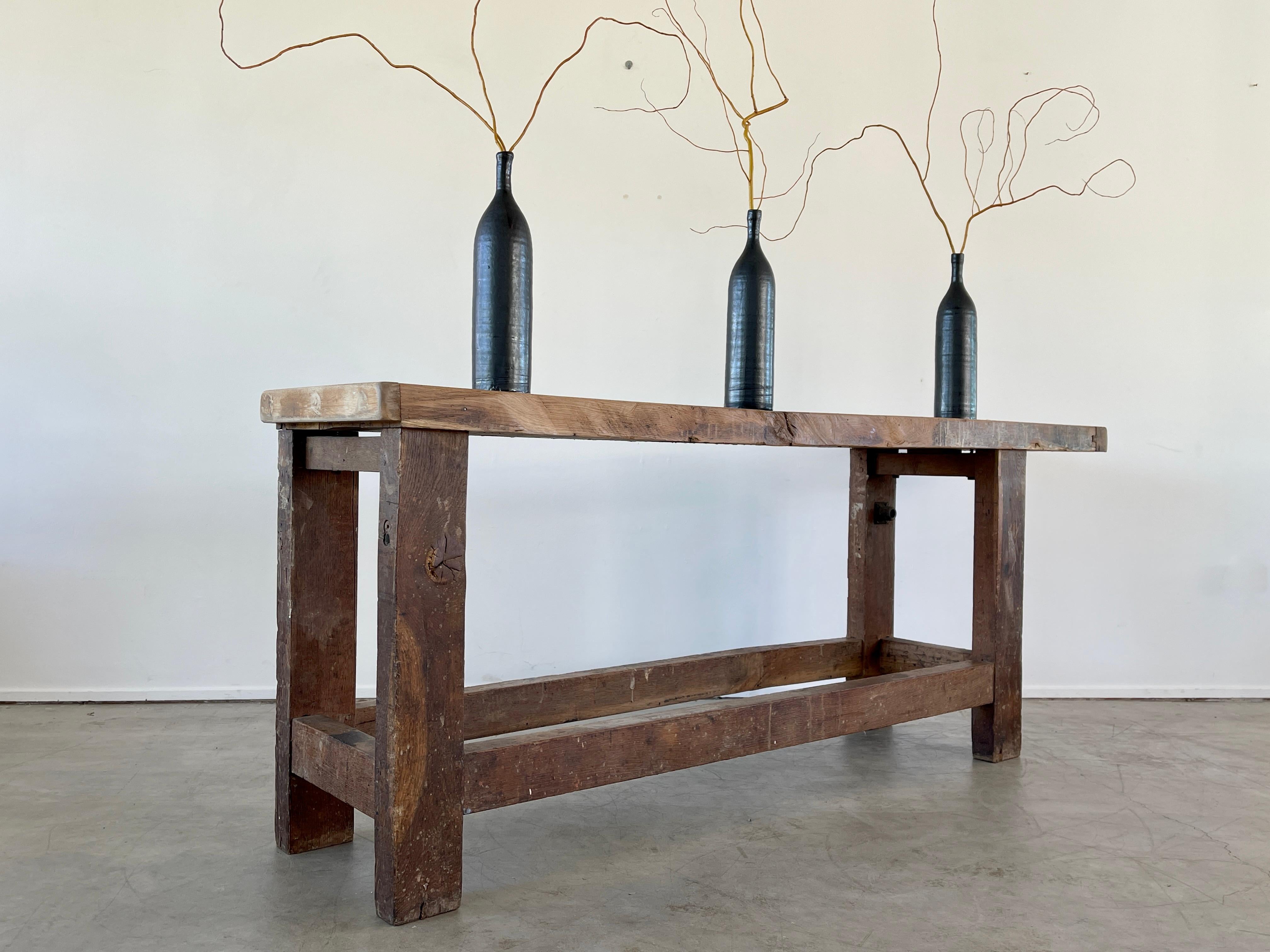 Turn of the century Carpenters Table - France 
Thick slab of wood with beautiful patina and simple modern asymmetrical shape.
Impressive in scale.