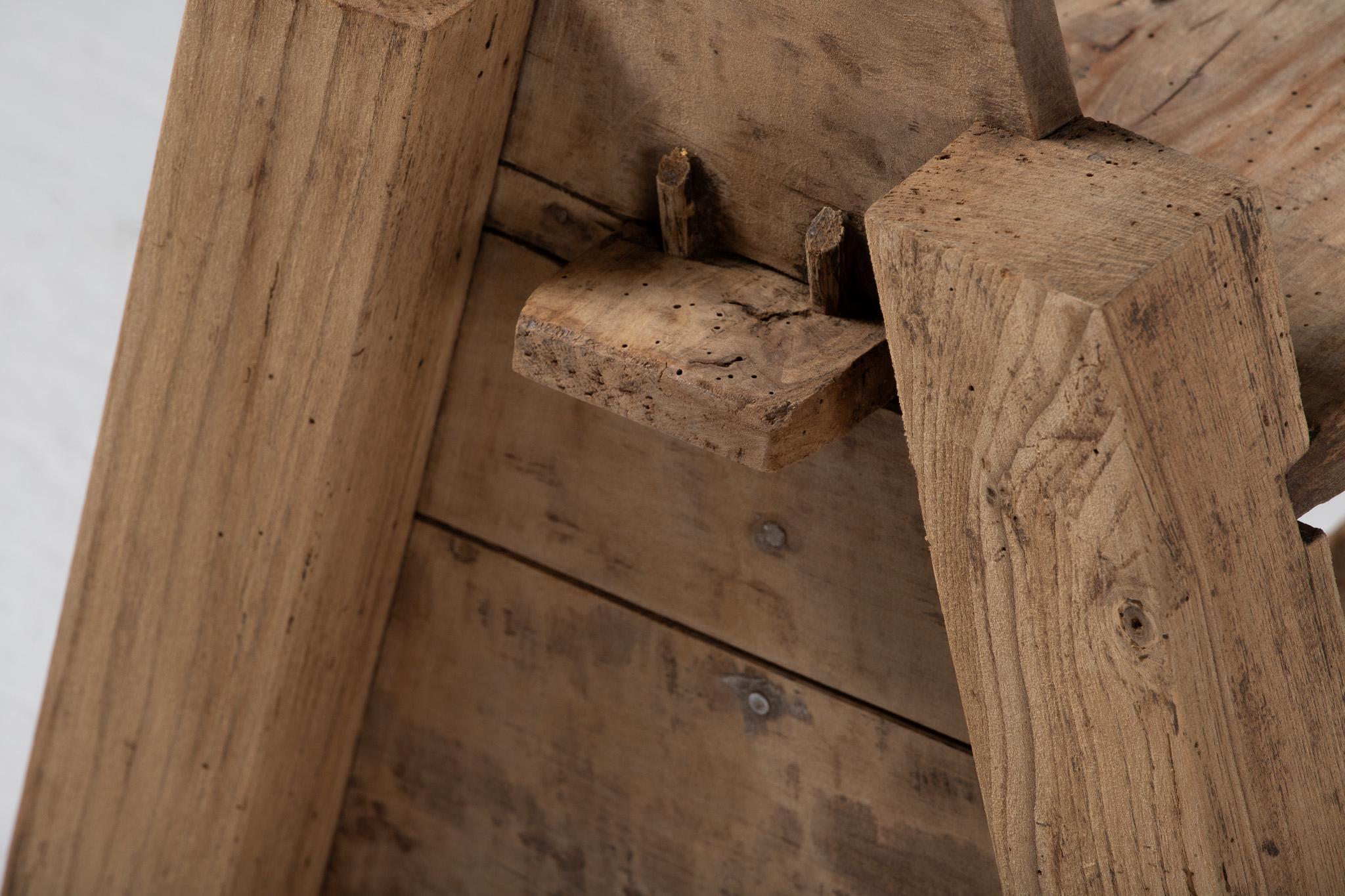 Angular and elemental, this French carpenter’s bench speaks in the quiet dialect of agrarian utility. Its silhouette—low, tapered, and architectural—evokes the austerity of a rural outbuilding, composed entirely of oak worn by decades of touch and