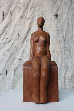 Primitive Carved Sitting Woman Sculpture